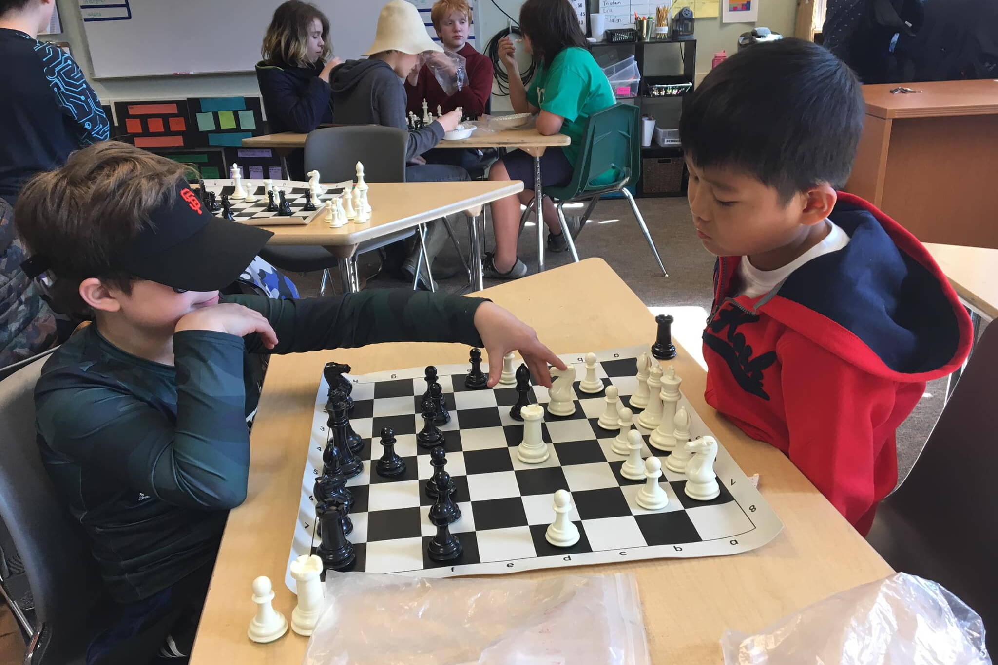 Students at Juneau Community Charter School play chess in a classroom. (Juneau School District photo)