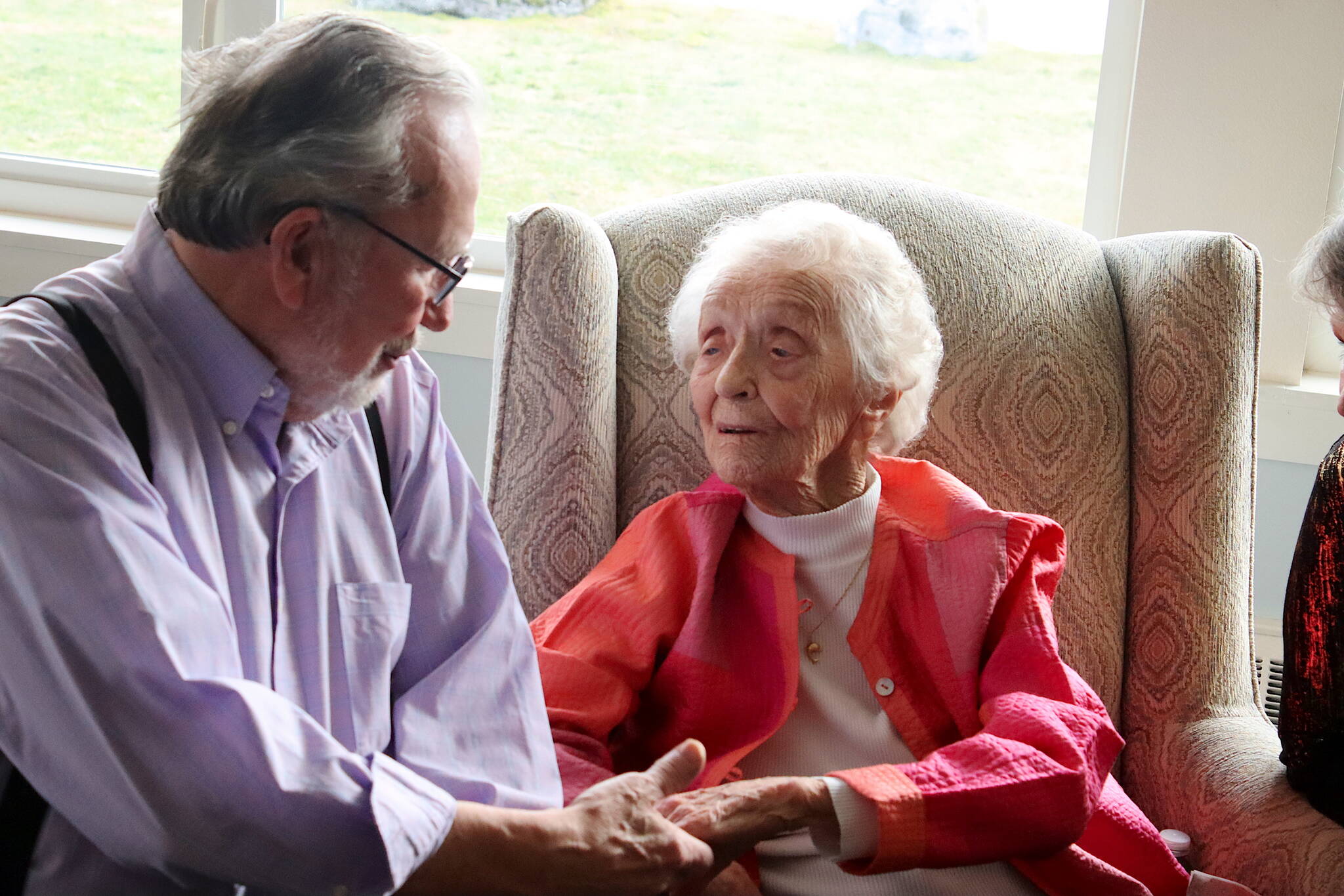 Jirdes Winther Baxter chats with Wayne Bertholl during her 100th birthday celebration Saturday at the Juneau Yacht Club. (Mark Sabbatini / Juneau Empire)