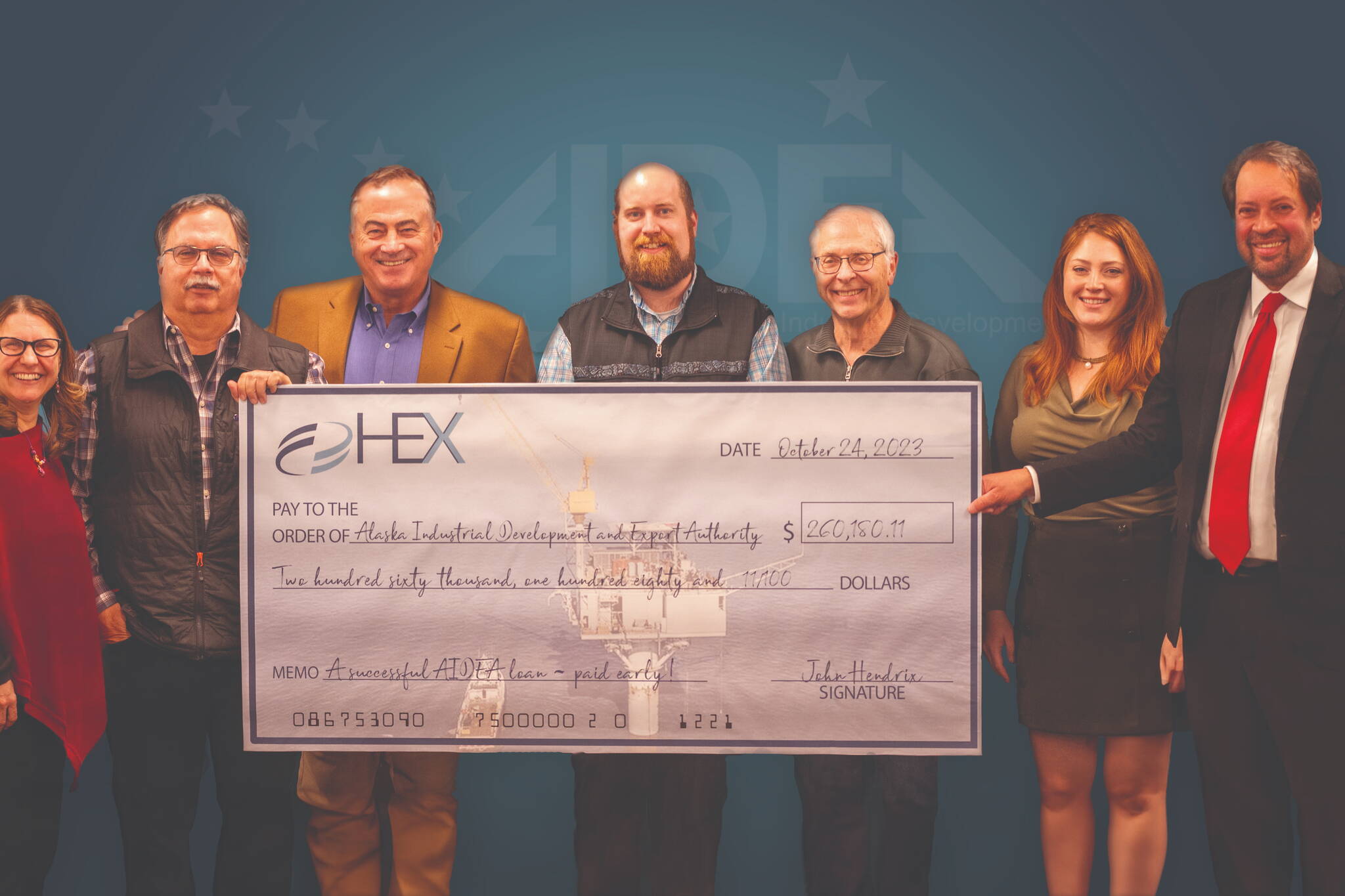 HEX Cook Inlet, LLC and Subsidiaries receives a check from the Alaska Industrial Development and Export Administration in October of 2023. (Photo courtesy of the Alaska Industrial Development and Export Administration)
