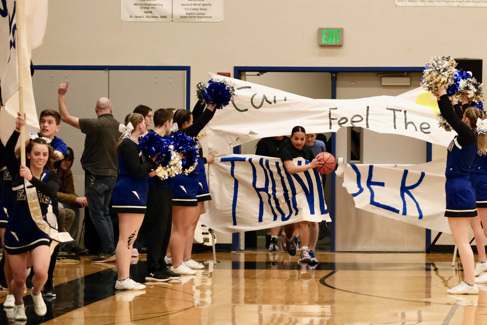 The Thunder Mountain High School Falcons girls basketball team comes onto the floor Saturday. (Klas Stolpe / For the Juneau Empire)