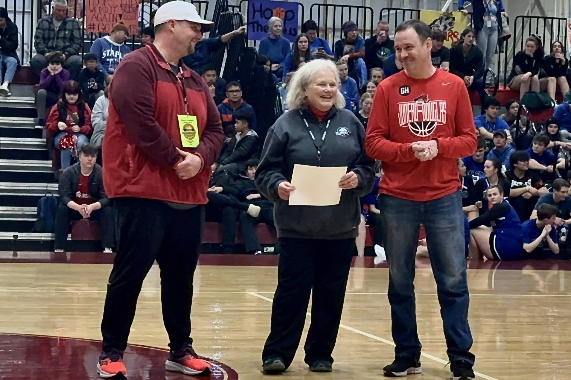 Sandi Wagner, the Alaska School Activities Association associate director, was honored with the first annual Coach George Houston Service Award on Wednesday during the Alaska Airlines Region V 4A Basketball Tournament at Mt. Edgecumbe High School’s B.J. McGillis Gymnasium in Sitka. Wagner is shown with Juneau-Douglas High School: Yadaa.at Kalé Activities Director Chad Benz and JDHS boys basketball coach Robert Casperson. (Photo courtesy Andrew Friske / MEHS)