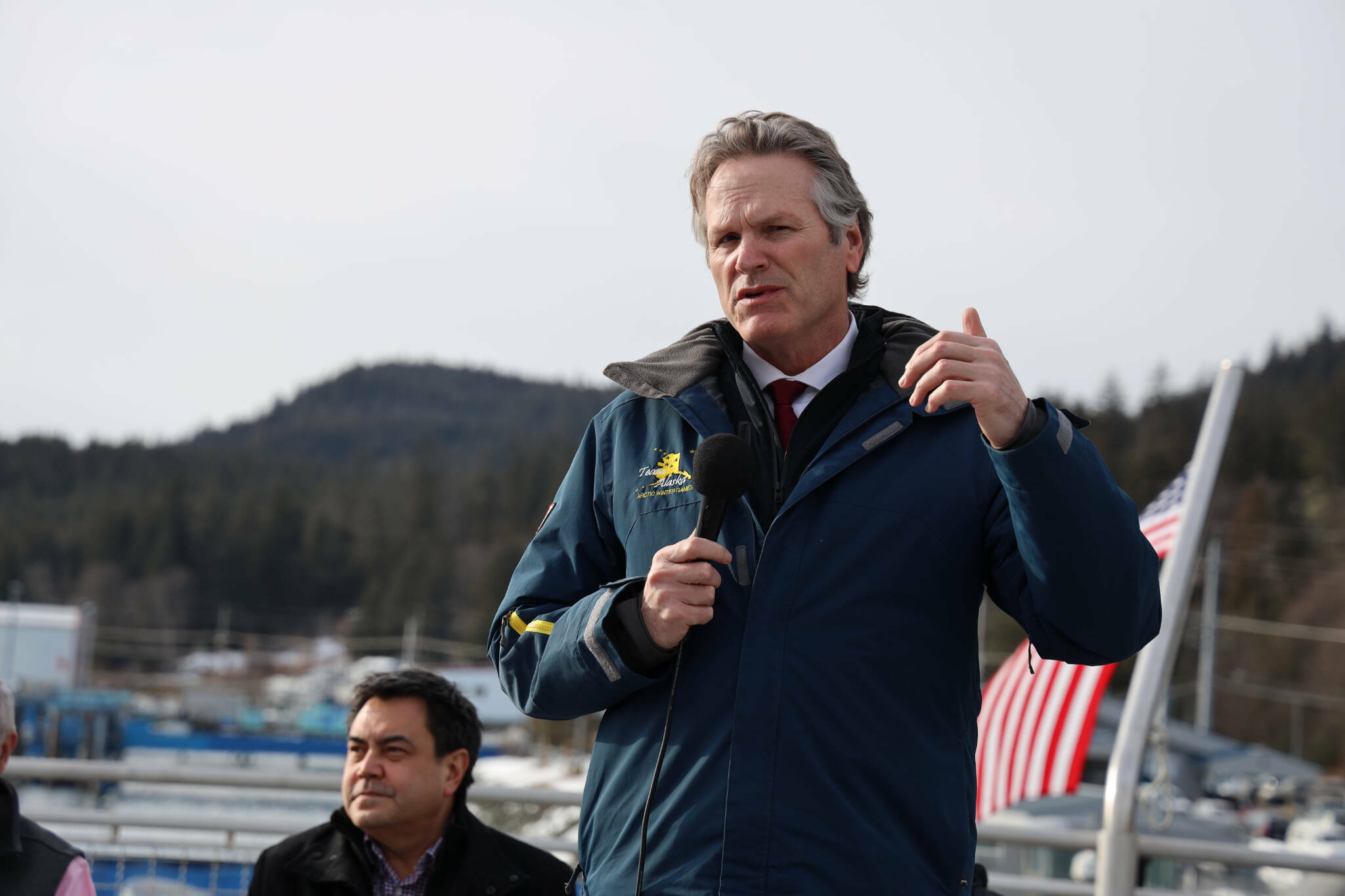 Gov. Mike Dunleavy speaks in March of 2023 in support of an agreement between the Alaska Department of Transportation and Public Facilities and Goldbelt Inc. to pursue engineering and design services to determine whether it’s feasible to build a new ferry terminal facility in Juneau at Cascade Point. (Clarise Larson / Juneau Empire file photo)