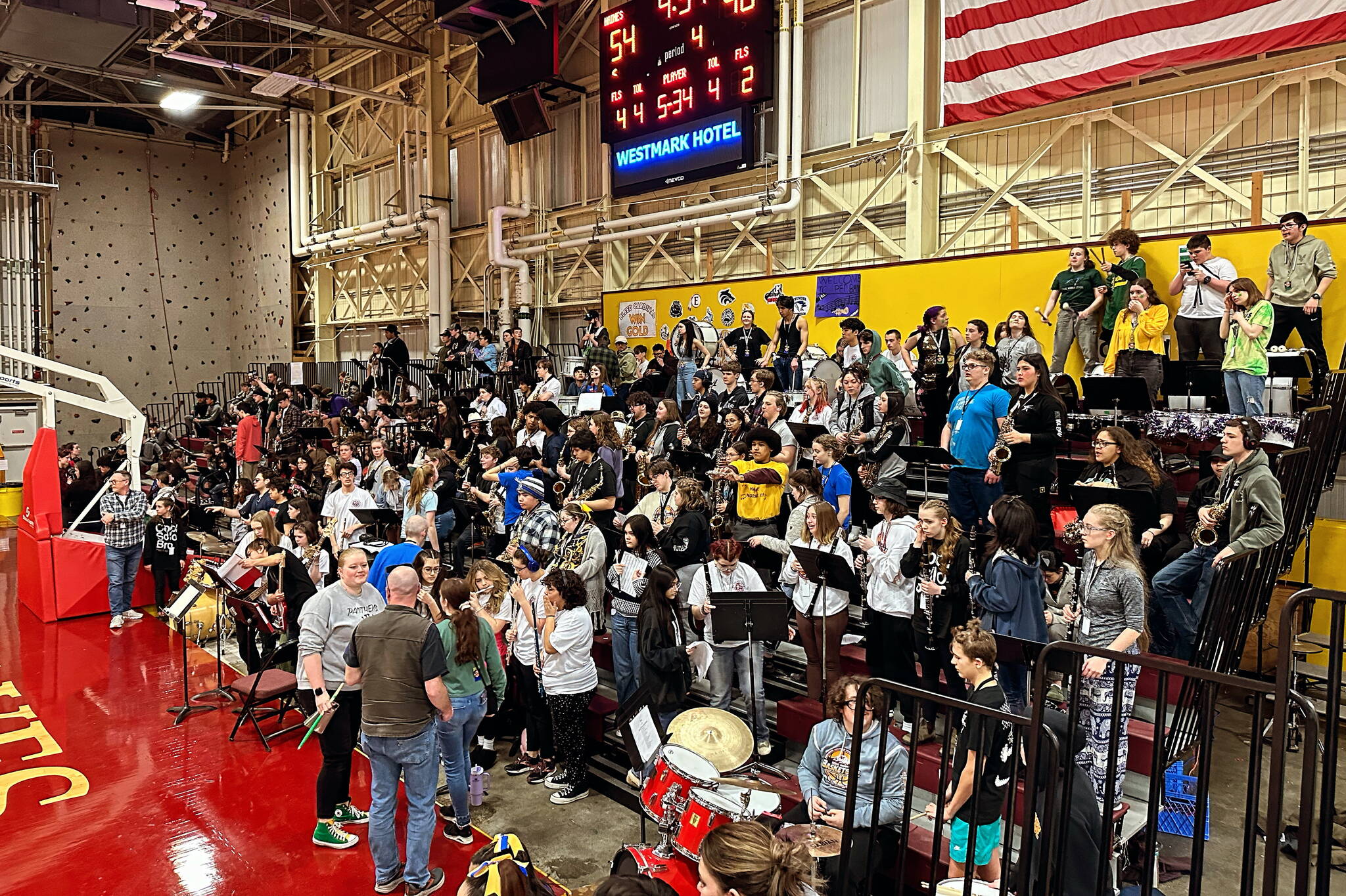 The 2024 Alaska Airlines Region V Basketball Tournament mass pep band, a combined musical extravaganza of Southeast high school pep band members, prepare to play during a game between Haines and Craig last week at the B.J. McGillis Gymnasium in Sitka. (Heather Gluth / MEHS)