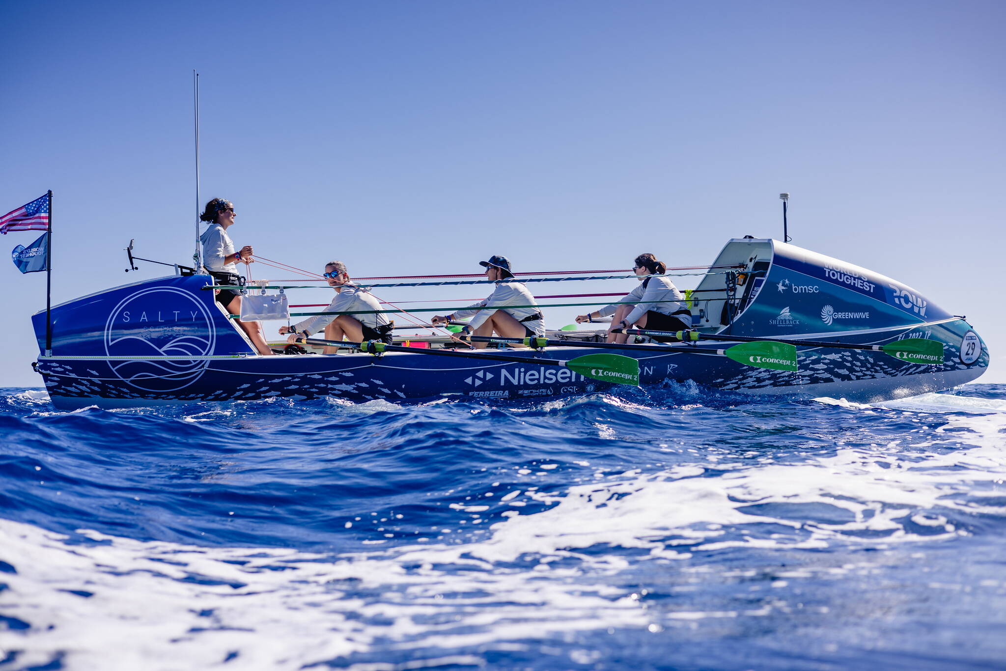 From left, Lauren Shea, Chantale Bégin, Isabelle Côté and Noelle Helder propel their 28-foot boat Emma off the coast of Florida during a training run for their crossing of the Atlantic Ocean. (Photo courtesy Noelle Helder)