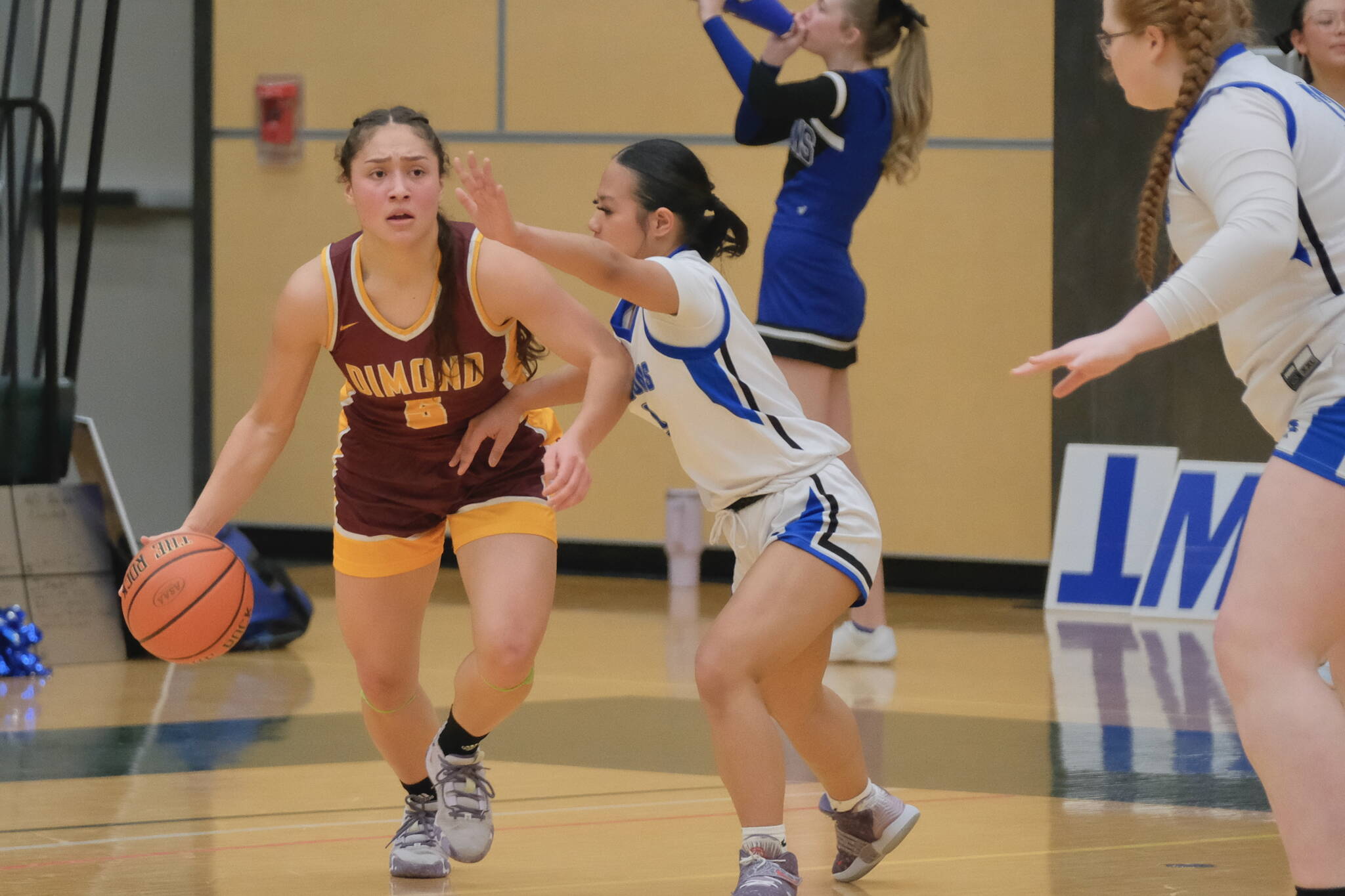 Thunder Mountain senior Jaya Carandang defends Dimond senior Maile Wilcox (5) during the Falcons 58-47 win over the Lynx in the 2024 ASAA March Madness Alaska 4A Girls Basketball State Championships on Wednesday at Anchorage’s Alaska Airlines Center. (Klas Stolpe / For the Juneau Empire)