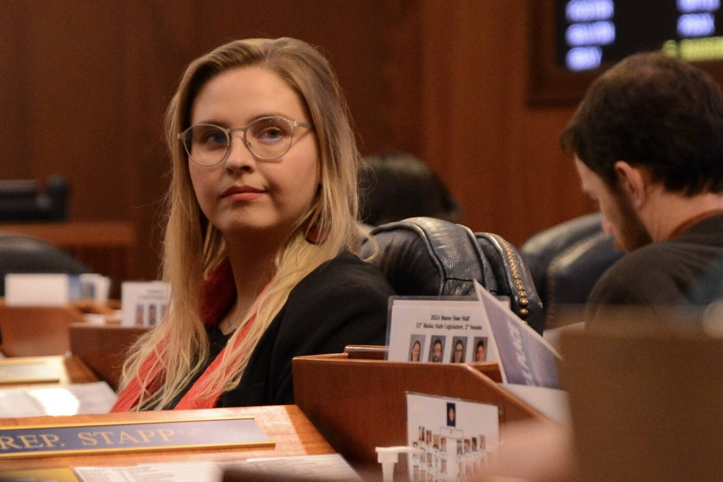 Rep. Ashley Carrick, D-Fairbanks, listens to debate in the Alaska House of Representatives on Thursday. (James Brooks/Alaska Beacon)