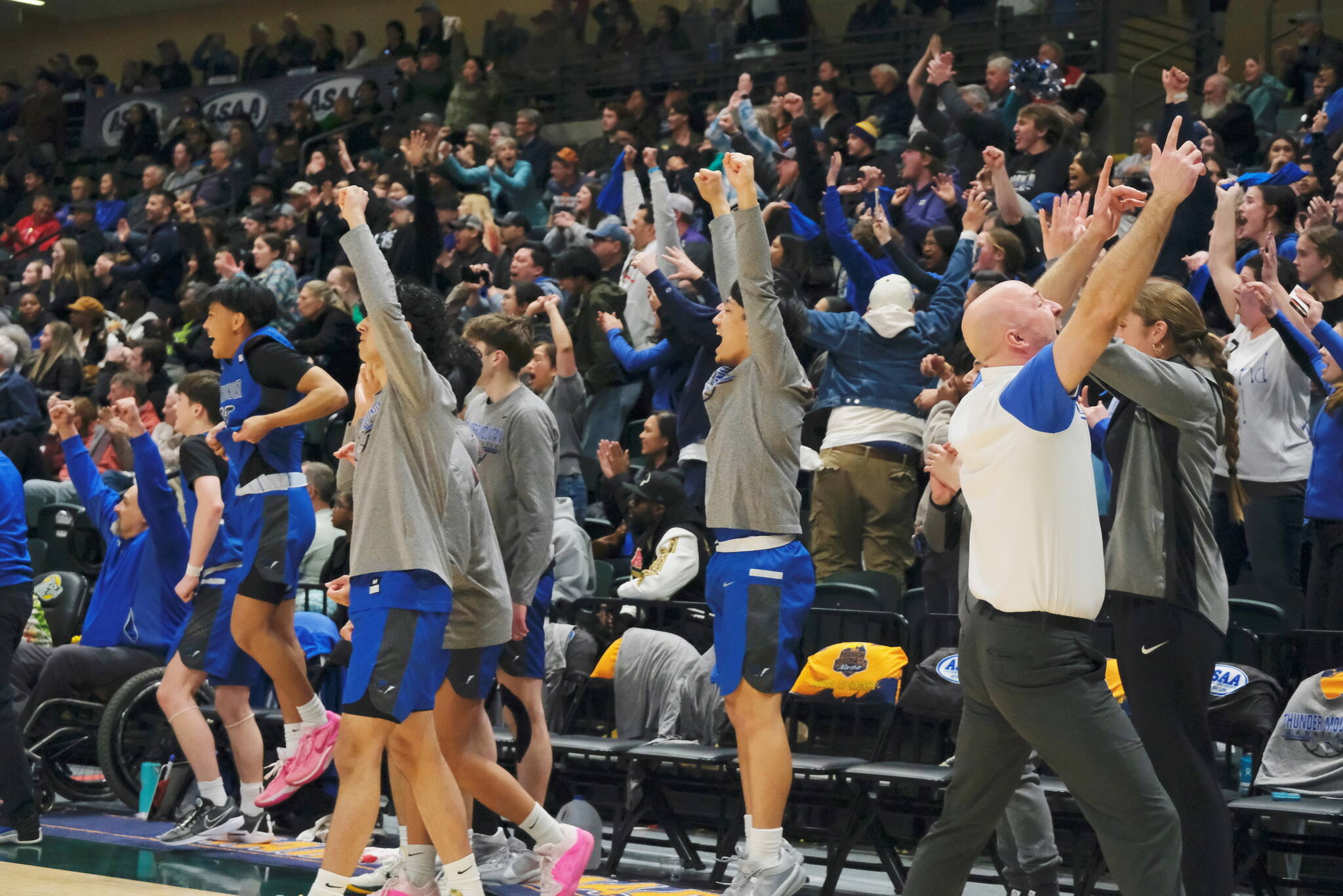 Thunder Mountain celebrates their 48-45 overtime win against the Service Cougars in a semifinal at the 2024 ASAA March Madness Alaska 4A Boys Basketball State Championships on Friday at Anchorages Alaska Airlines Center. The Falcons will play East Anchorage for the state championship Saturday. (Klas Stolpe / For the Juneau Empire)