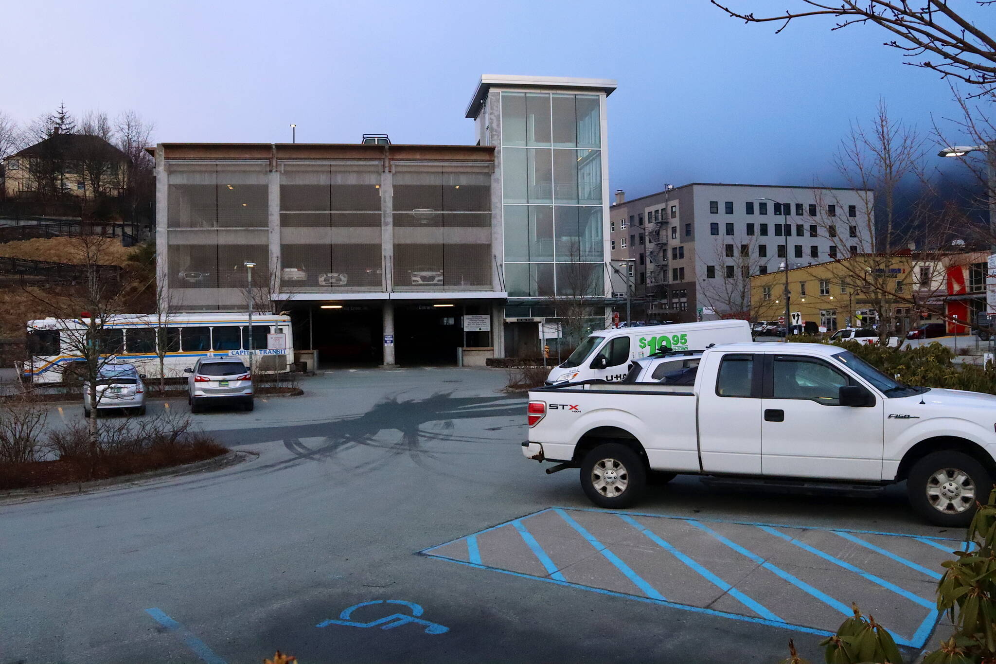 The Shopper’s Lot is among two of downtown Juneau’s three per-hour parking lots where the cash payments boxes are missing due to vandalism this winter. But as of Wednesday people can use the free ParkSmarter app to make payments by phone. (Mark Sabbatini / Juneau Empire)
