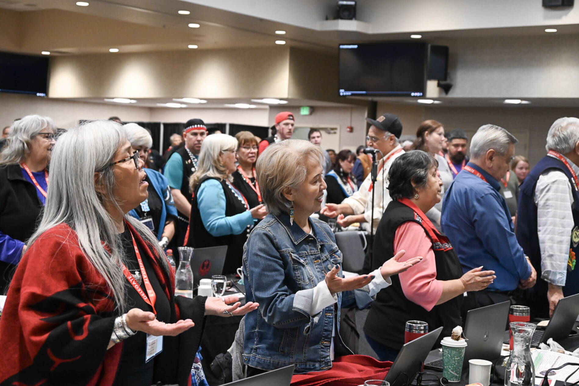 Delegates offer prayers during the Central Council of the Tlingit and Haida Indian Tribes of Alaska’s 89th Annual Tribal Assembly on Thursday at Elizabeth Peratrovich Hall. (Muriel Reid / Central Council of Tlingit and Haida Indian Tribes of Alaska)