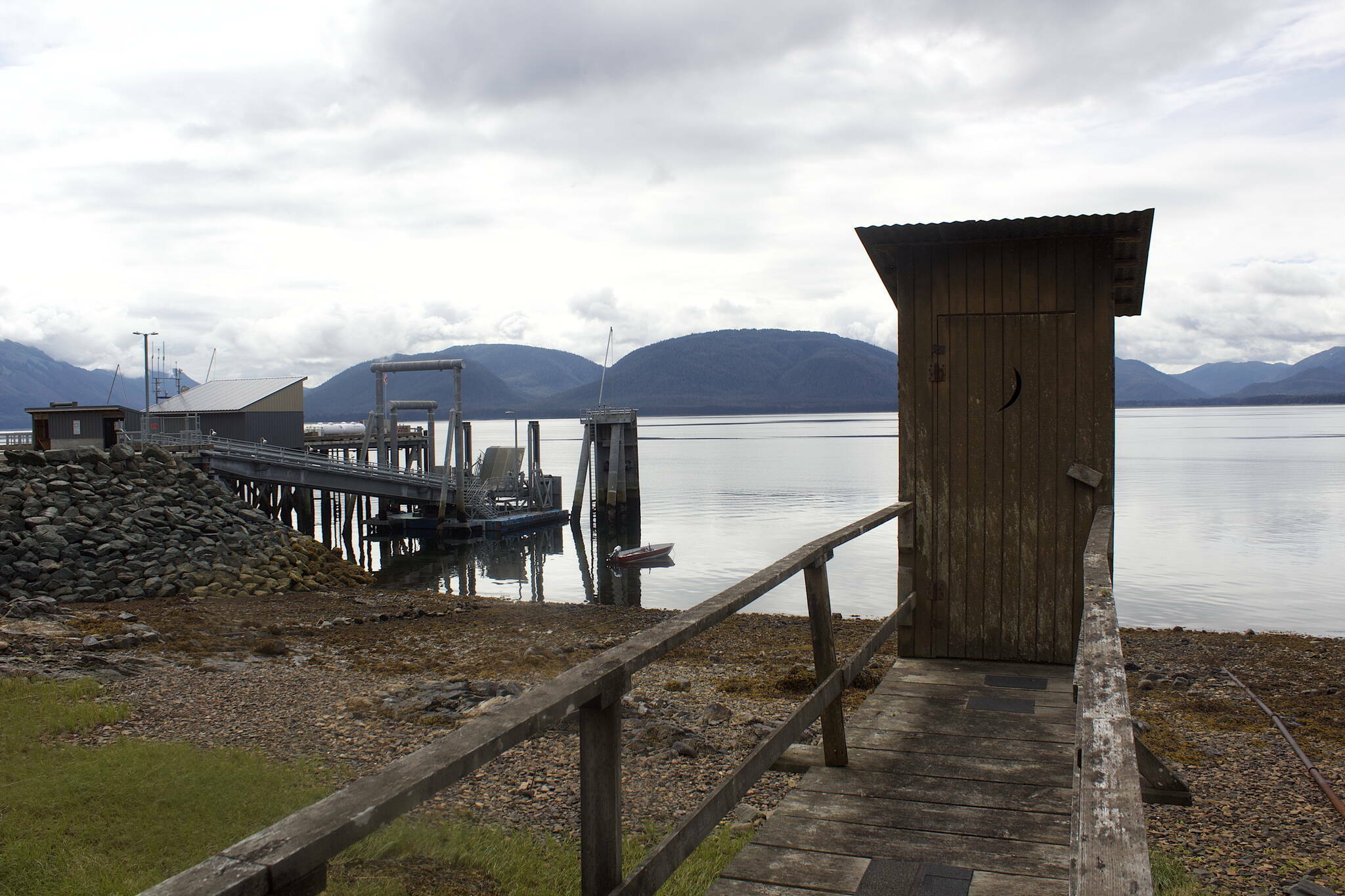 An aging outhouse on the pier extending out from the fire station that’s purportedly the only public toilet in Tenakee Springs in August of 2022. (Mark Sabbatini / Juneau Empire file photo)