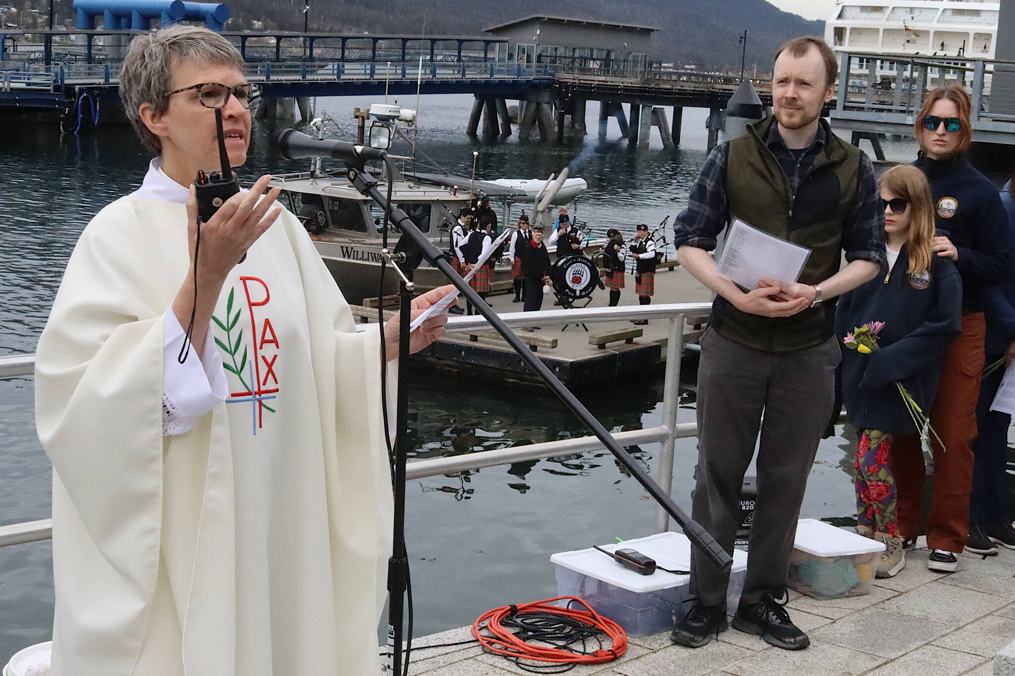 Pastor Tari Stage-Harvey offers an invocation during the annual Blessing of the Fleet and Reading of Names at the Alaska Commercial Fishermen’s Memorial on Saturday morning. (Mark Sabbatini / Juneau Empire)