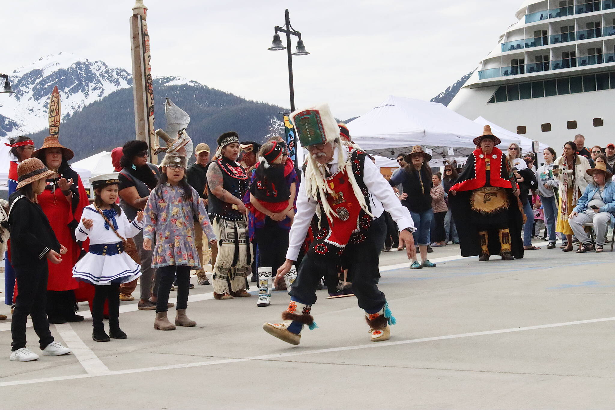 Walter Soboleff Jr. leads a traditional Alaska Native dance during the beginning of the Juneau Maritime Festival at Elizabeth Peratrovich Plaza on Saturday morning. (Mark Sabbatini / Juneau Empire)