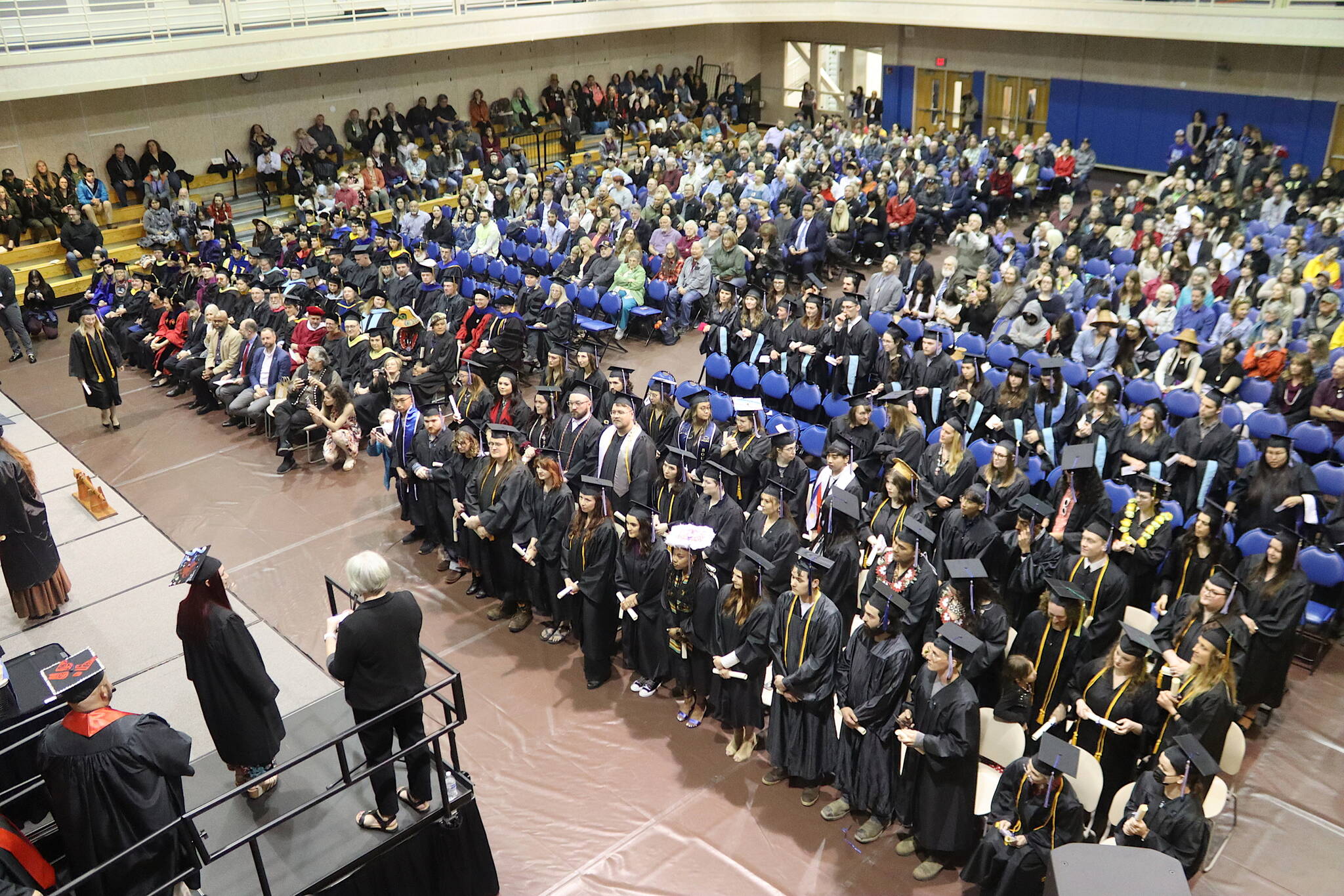 The University of Alaska Southeast class of 2024 receive their degrees during a commencement ceremony Sunday at the UAS Recreation Center. (Mark Sabbatini / Juneau Empire)