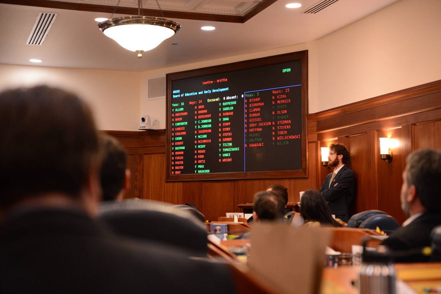 Members of the state House and Senate look at a tally board showing the failure of Bob Griffin to be confirmed to the Alaska state school board on Tuesday. (James Brooks/Alaska Beacon)