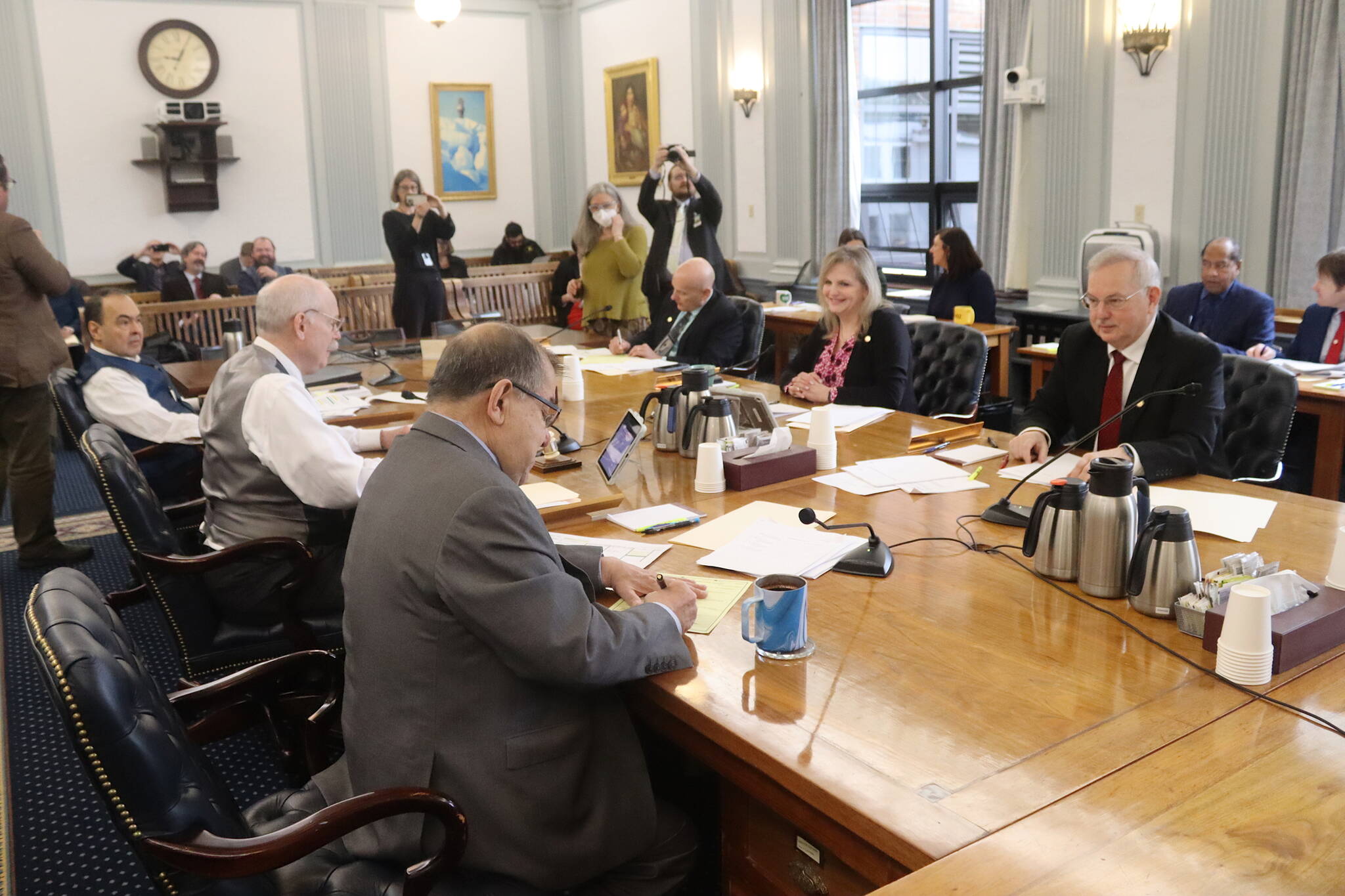 House and Senate members of a conference committee sign the compromise state budget bill for the next fiscal year after the final provisions were agreed upon Tuesday morning at the Alaska State Capitol. (Mark Sabbatini / Juneau Empire)