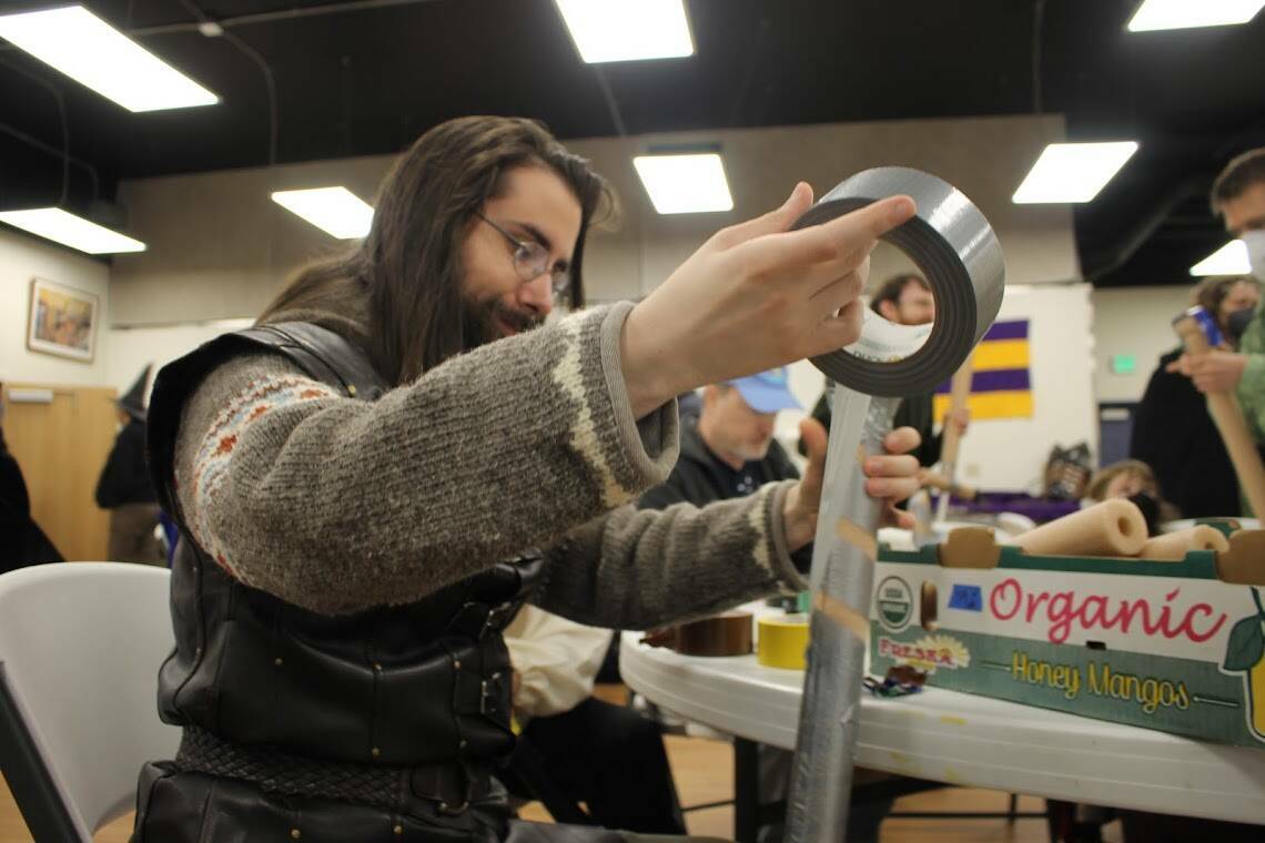 An aspiring knight relies on duct tape for his medieval battle gear during the Master’s Faire on July 16, 2022. (Clarise Larson / Juneau Empire file photo)