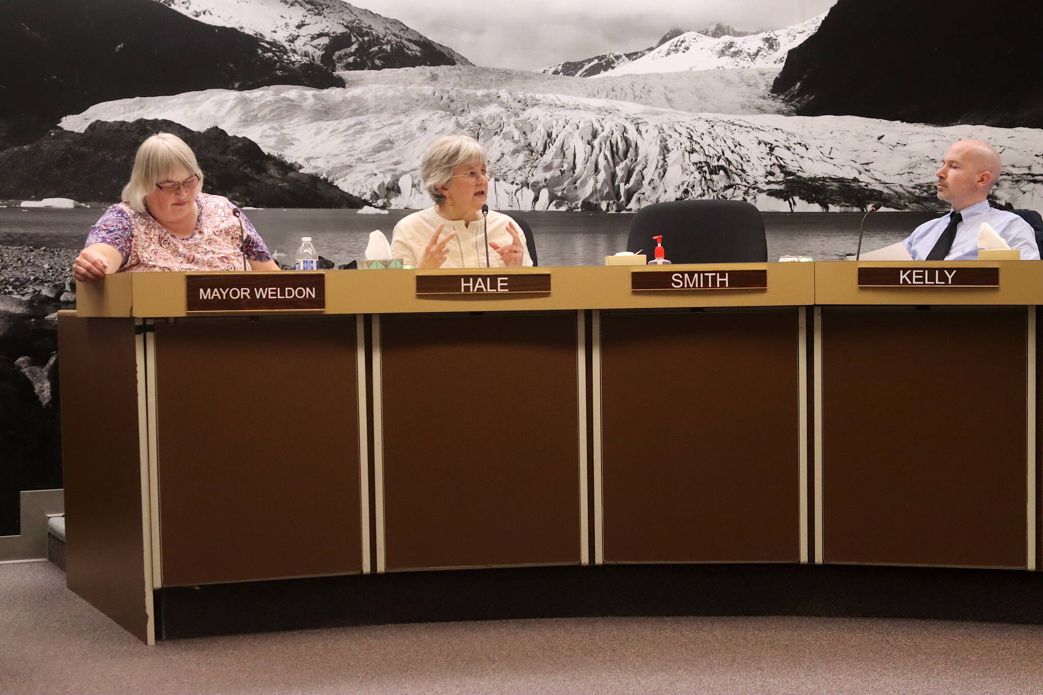 Mayor Beth Weldon (left), Deputy Mayor Michelle Bonnet Hale and Juneau Assembly member Paul Kelly discussion proposals for next year’s mill rate during an Assembly Finance Committee meeting on Wednesday night. (Mark Sabbatini / Juneau Empire)