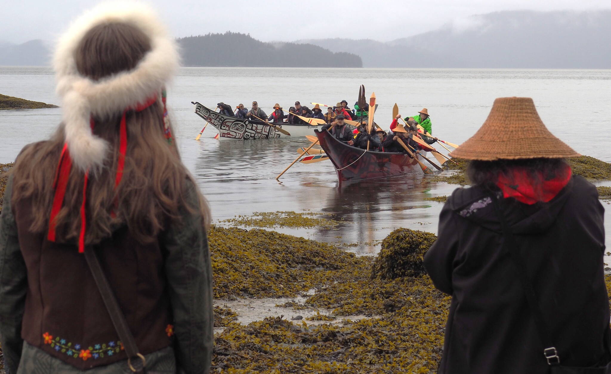 Anchorage pullers arrived at Wrangell’s Petroglyph Beach on May 23 for a canoe-naming ceremony. One of the canoes they will paddle to Juneau was dedicated to Wrangell’s Marge Byrd, Kiks.adi matriarch Shaawat Shoogoo. The canoe’s name is Xíxch’ dexí (Frog Backbone). (Becca Clark / Wrangell Sentinel)