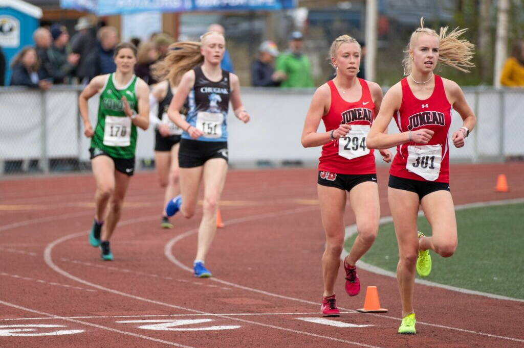 Juneau-Douglas High School: Yadaa.at Kalé’s Ida Meyer (301) and Etta Eller (294) lead the 3,200 at the ASAA/First National Bank Alaska Track and Field State Championships on Saturday. (Pete Pounds / Alaska Sports Report)