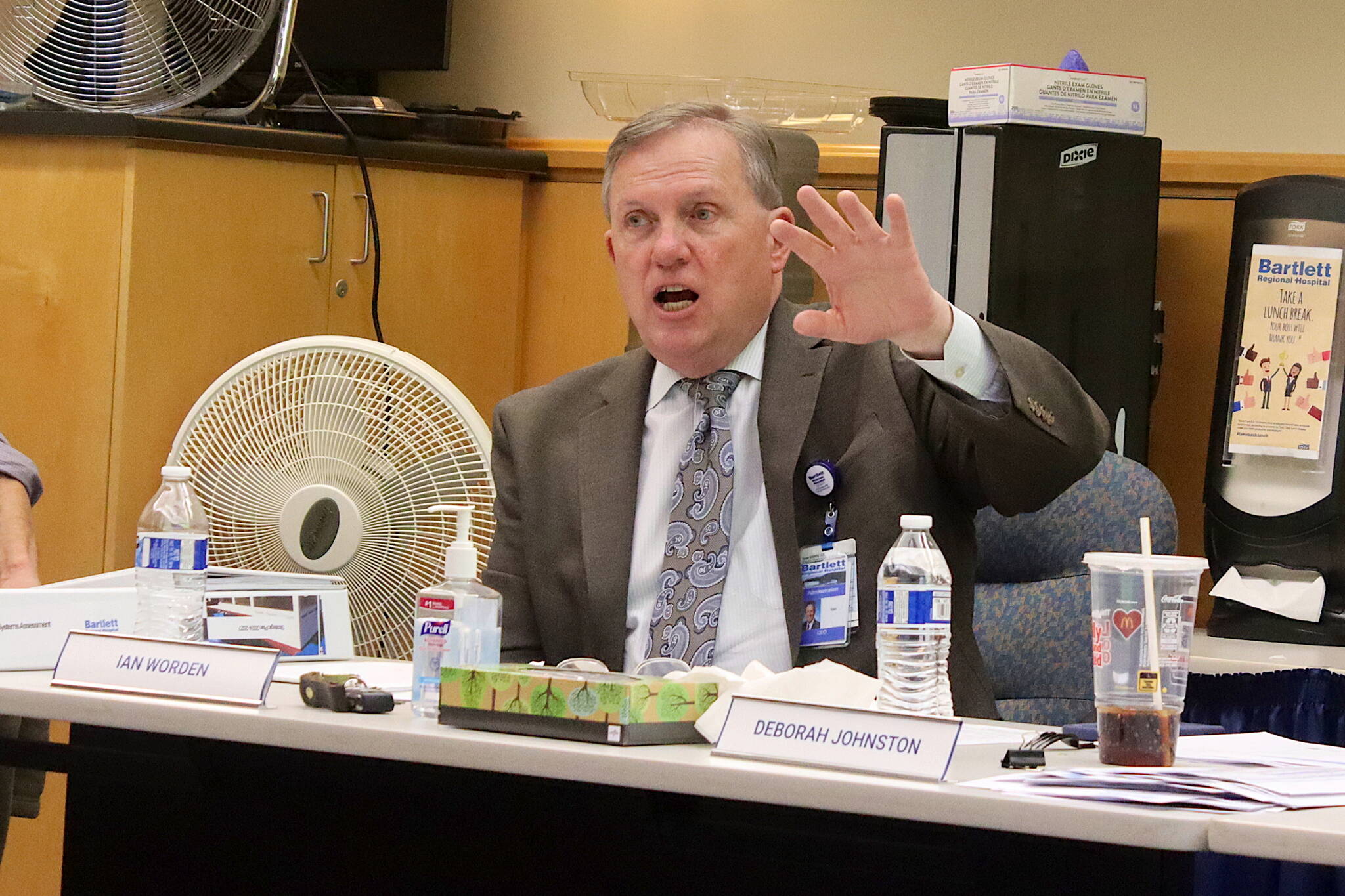 Ian Worden, interim CEO at Bartlett Regional Hospital, presents an update about the hospital’s financial situation during a board of directors meeting on Tuesday night. (Mark Sabbatini / Juneau Empire)