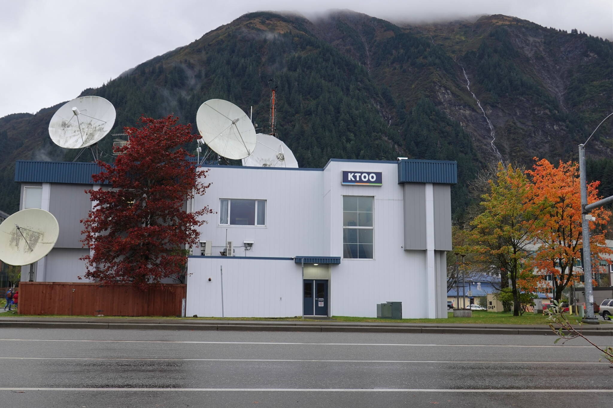 The present-day KTOO public broadcasting building, built in 1959 for the U.S. Armys Alaska Communications System Signal Corps, is located on filled tidelands near Juneaus subport. Today vehicles on Egan Drive pass by the concrete structure with satellite dishes on the roof that receive signals from NPR, PBS and other sources. (Laurie Craig / Juneau Empire)