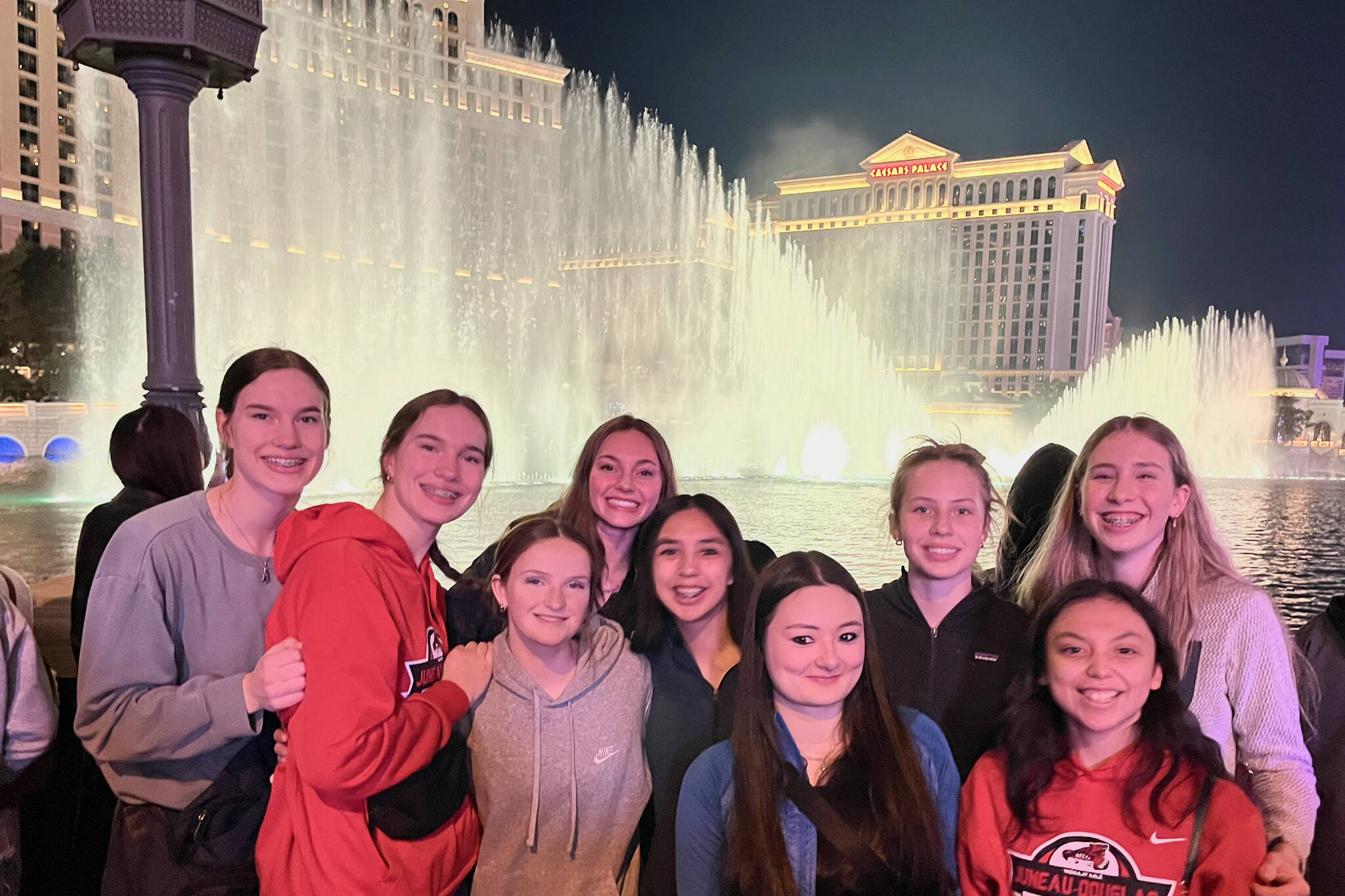 The Juneau-Douglas High School: Yadaa.at Kalé Crimson Bears girls basketball team pose at the Ceasar’s Palace fountain in Las Vegas during the Tarkanian Classic Tournament. (Photo courtesy JDHS Crimson Bears)