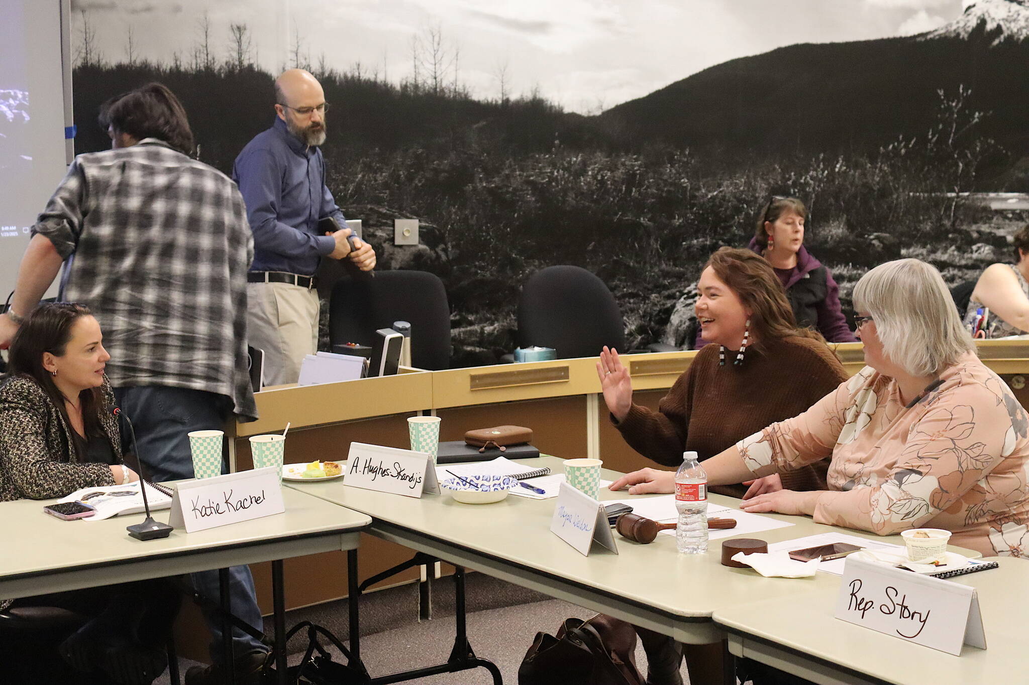 Katie Kachel (left), a federal lobbyist for the City and Borough of Juneau, talks with Juneau Assembly Member Alicia Hughes-Skandijs and Mayor Beth Weldon following a joint meeting of the Assembly and Juneaus legislative delegation on Thursday at the Assembly Chambers. (Mark Sabbatini / Juneau Empire)