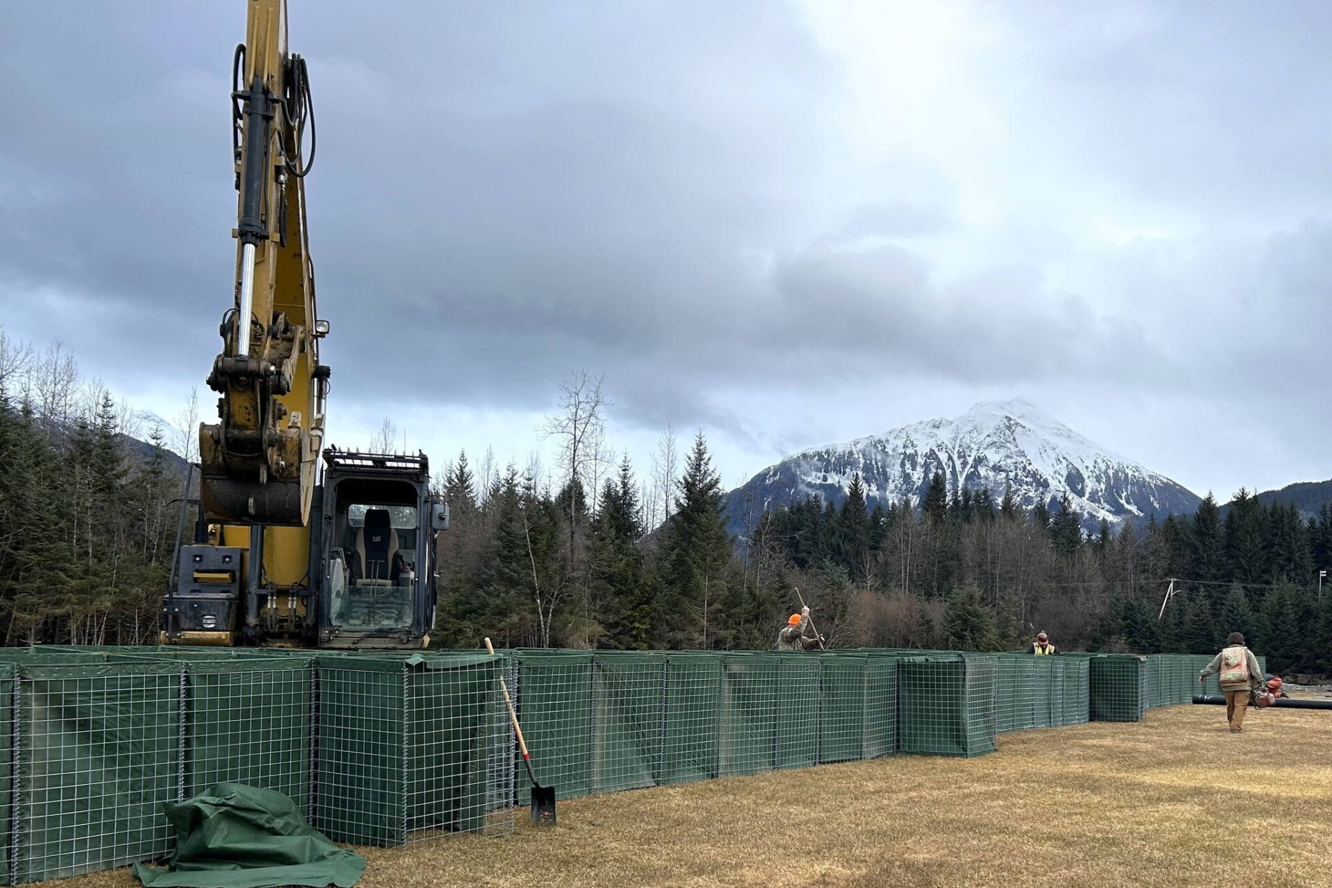 Installation of HESCO floodprotection barriers begins along Mendenhall
