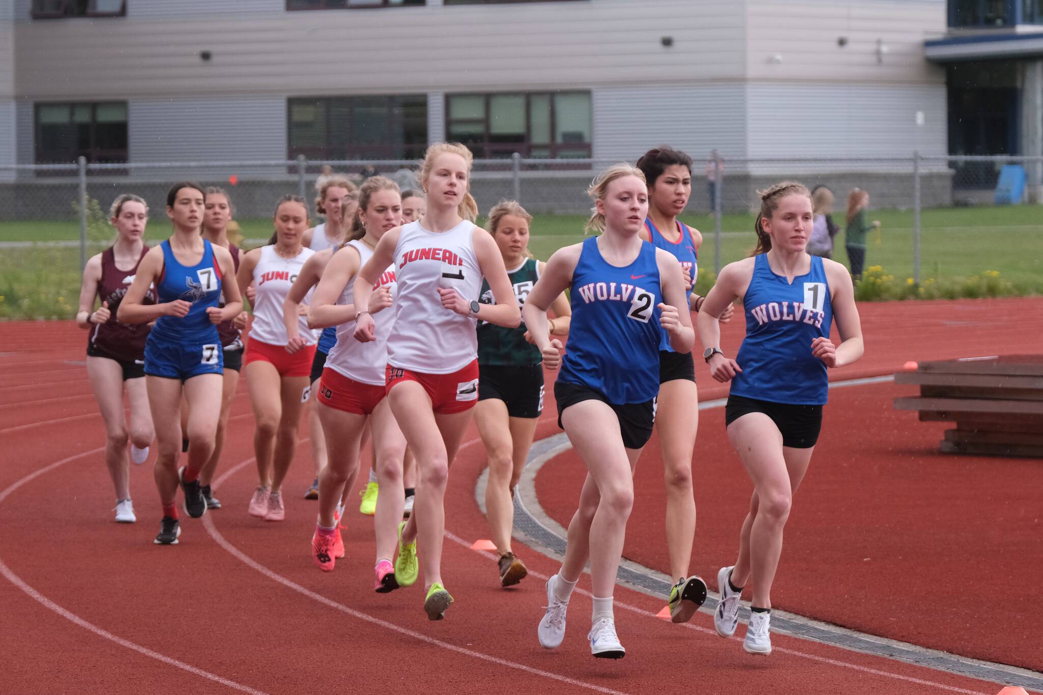 Juneau-Douglas High School: Yadaa.at Kalés Ida Meyer (1) and Sitkas Marina Dill (2) and Clare Mullin (1) lead the start of the combined DI and DII 3200 during the Region V Track & Field Championships Friday at Thunder Mountain Middle School. (Klas Stolpe / Juneau Empire)