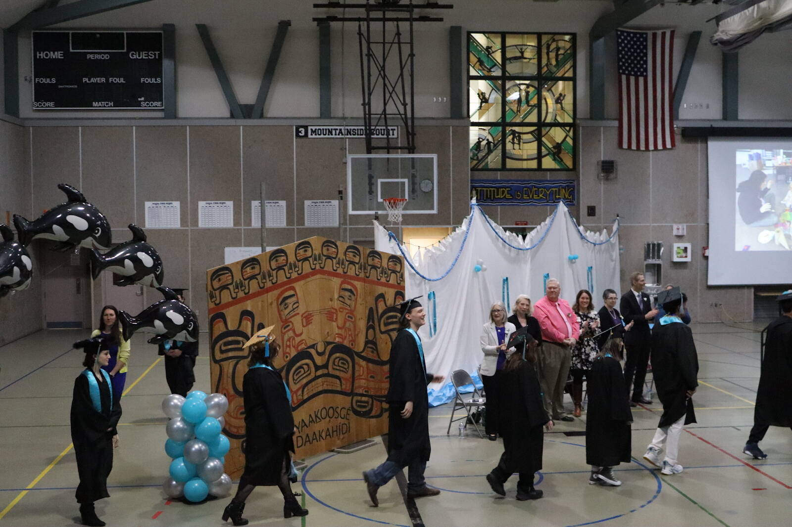 Yaaḵoosgé Daakahídi High Schools seniors enter the Dzantiki Heeni gymnasium during the schools graduation ceremony Sunday, May 25, 2025. (Ellie Ruel / Juneau Empire)