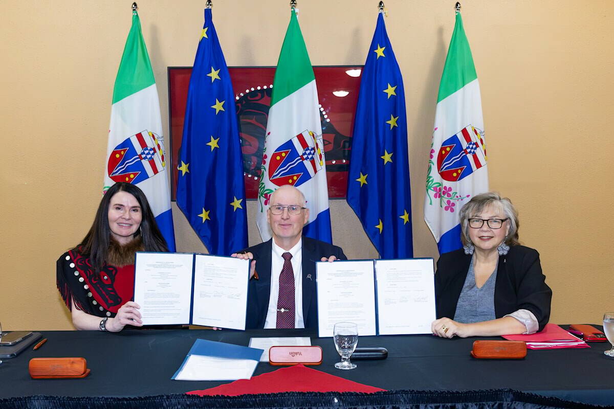 Jeanie McLean, James Cockrell and Tracy-Anne McPhee signed a memorandum of understanding on behalf of Yukon and Alaska on Aug. 12, 2025, to share information on gender-based violence in the North. (Yukon government/Yukon.ca)