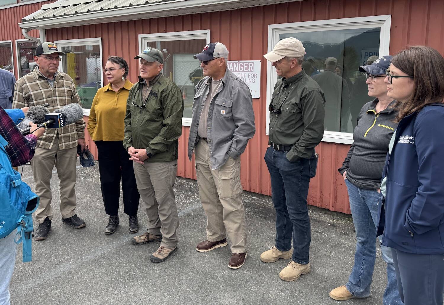 Members of the U.S. House Committee on Natural Resources talk with reporters at Juneau International Airport on Monday, Aug. 25, 2025. (Photo by James Brooks/Alaska Beacon)