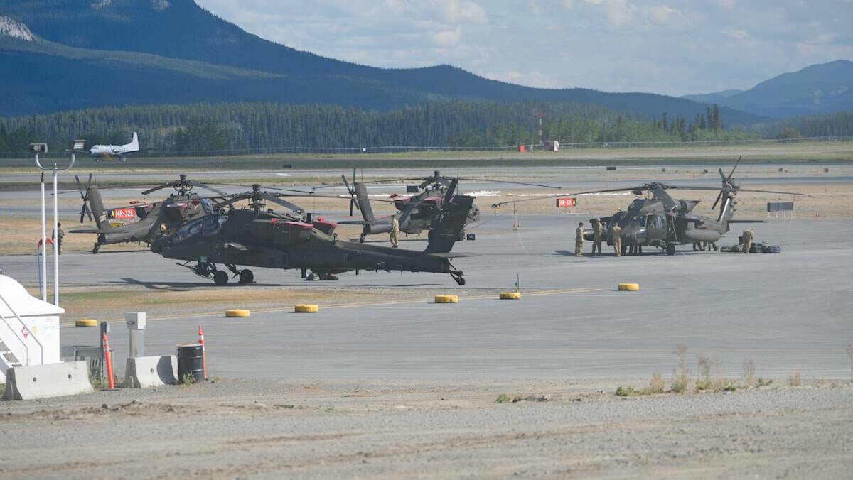 United States Army helicopters including AH-64 Apaches stopped off at the Whitehorse airport on Aug. 13. (Jim Elliot/Yukon News)