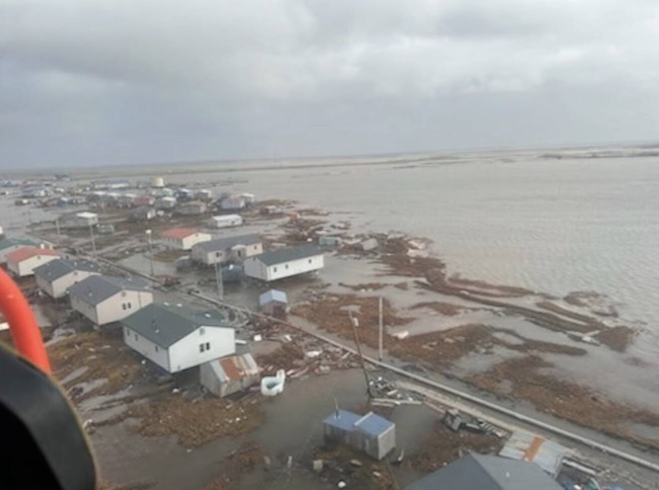 U.S. Coast Guard MH-60 Jayhawk helicopter aircrews conduct overflights of Kipnuk, Alaska, after coastal flooding impacted several western Alaska communities, Oct. 12, 2025. (U.S. Coast Guard photo courtesy of Air Station Kodiak)