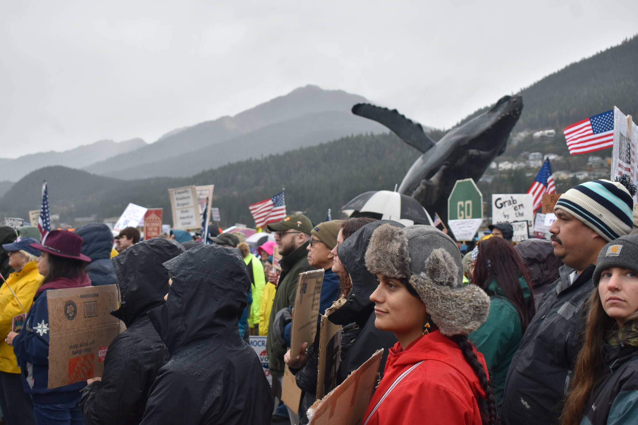 Protesters stand at the No Tsars, No Kings protest on Saturday, Oct. 18 at Overstreet Park. (Mari Kanagy/Juneau Empire)