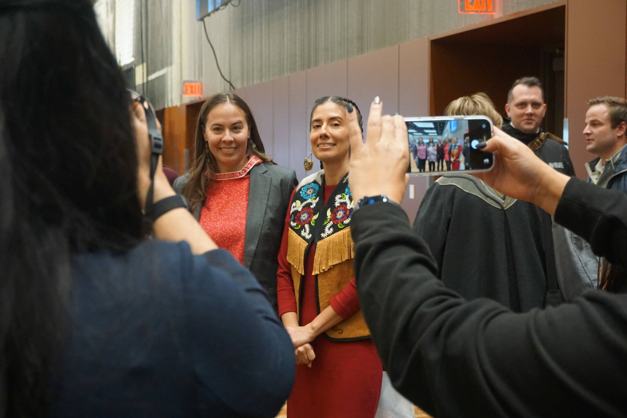 Photos by Yereth Rosen/Alaska Beacon
Natasha Singh poses for photos in the hallway of the Dena’ina Civic and Convention Center, site of the Alaska Federation of Natives annual convention. Singh, who is president of the Alaska Native Tribal Health Consortium, had just delivered her keynote speech on the opening morning of the convention.