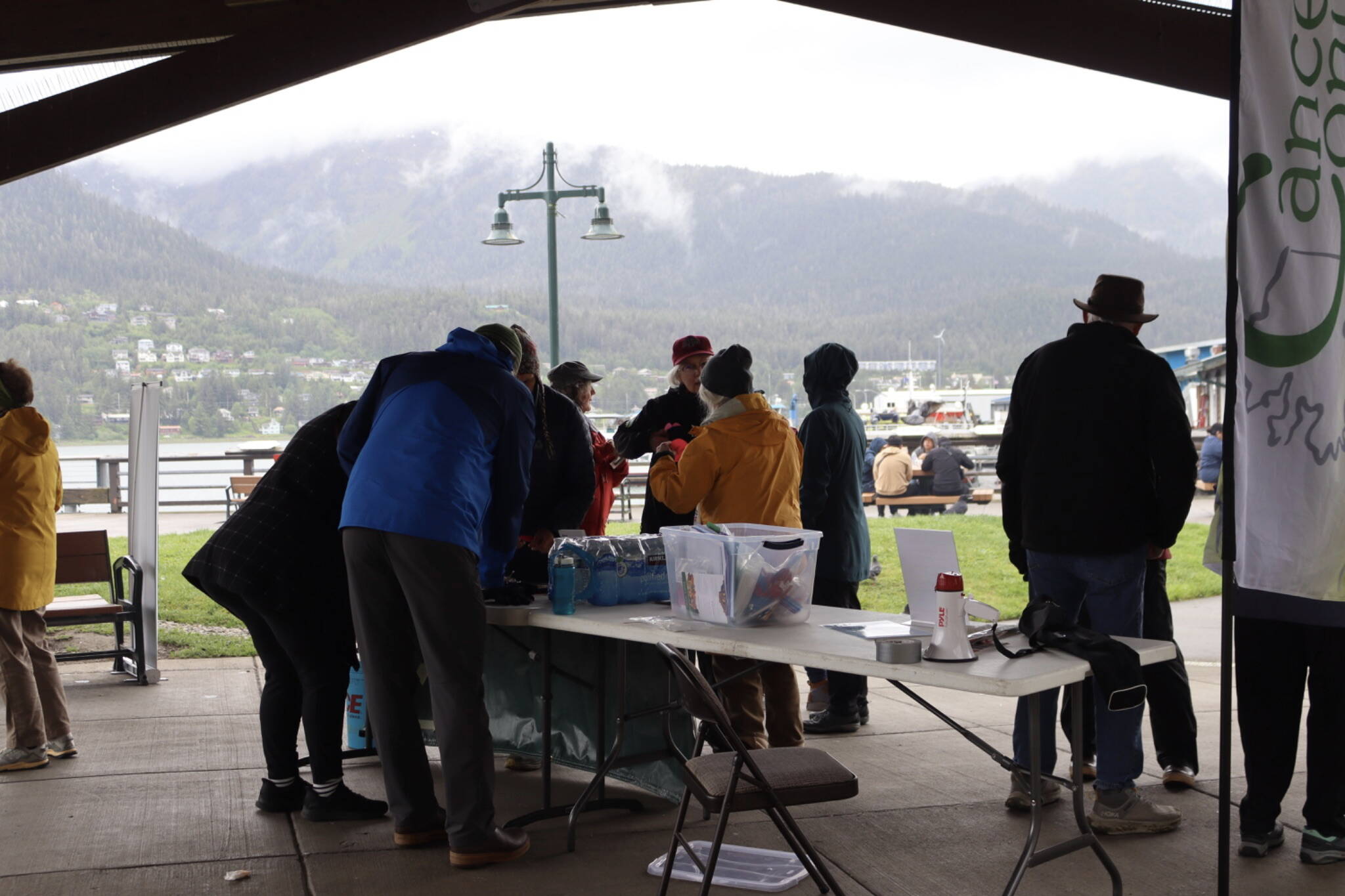 Ellie Ruel / Juneau Empire File
Participants grab placards, flowers and hearts at Marine Park before the Cancer Survivors Day walk on June 8, 2025.