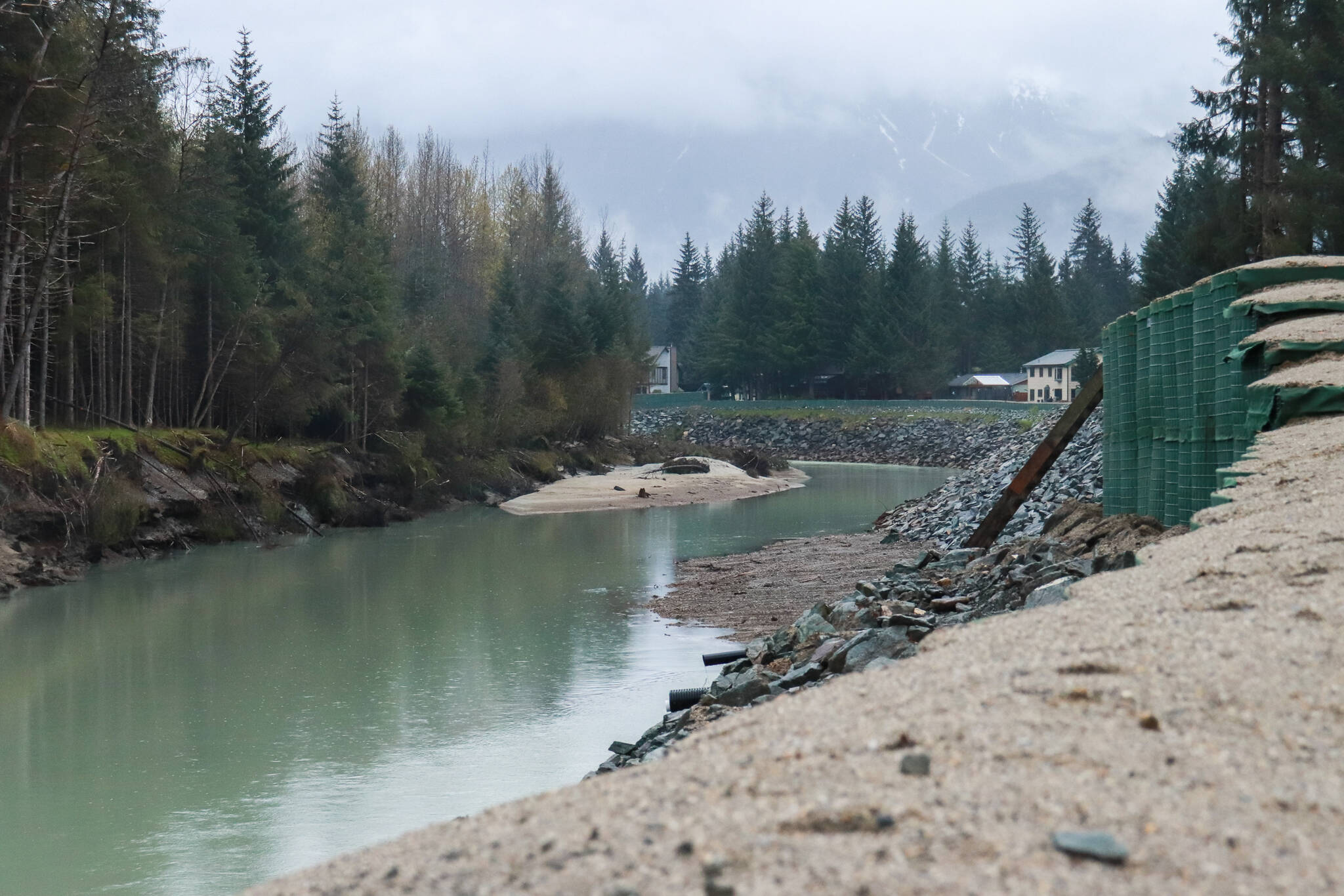 HESCO barriers line the Mendenhall River on Monday, May 12, 2025. (File photo, Jasz Garrett/Juneau Empire)