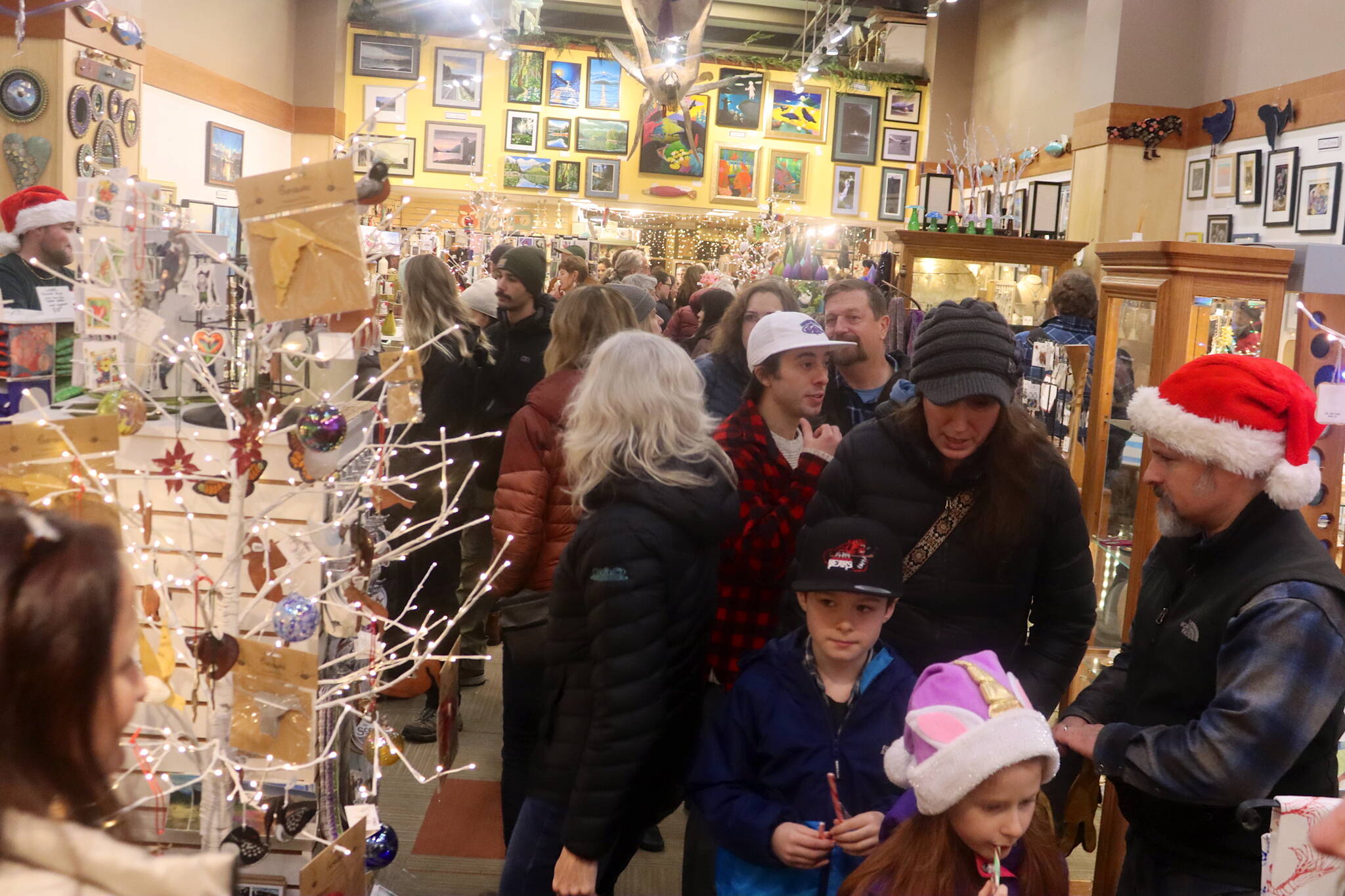 Browsers crowd into Annie Kaill’s gallery and gift shop during the 2024 Gallery Walk. (Juneau Empire file photo)
