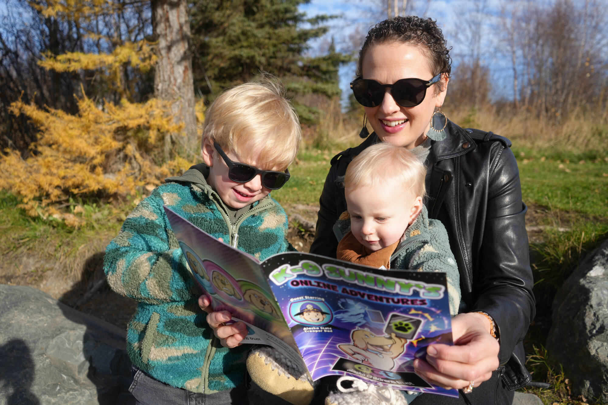 Alaska Childrens Trust photo
Oliva, River, and Oliver Jenkins read the online safety comic produced by the Alaska Childrens Trust.