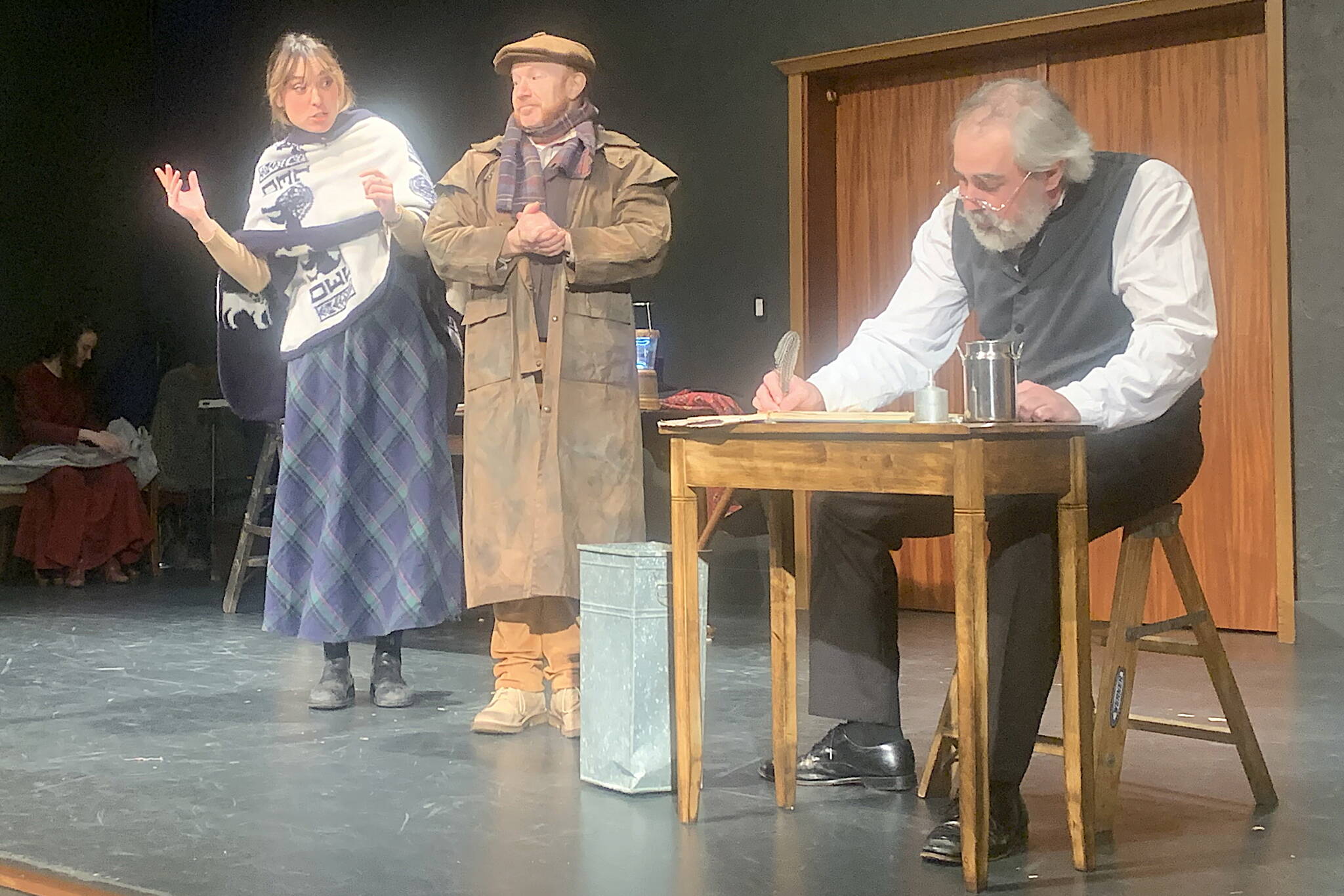 Charity collectors Peppin (played by Natalia Spenglere) and “Salt” played by (Roblin Gray Davis) try in vain to get a donation from Ebenezer Scrooge (played by Tom Robenolt) during Theater Alaska’s production of "A Christmas Carol" on Sunday at McPhetres Hall. (Mark Sabbatini / Juneau Empire)