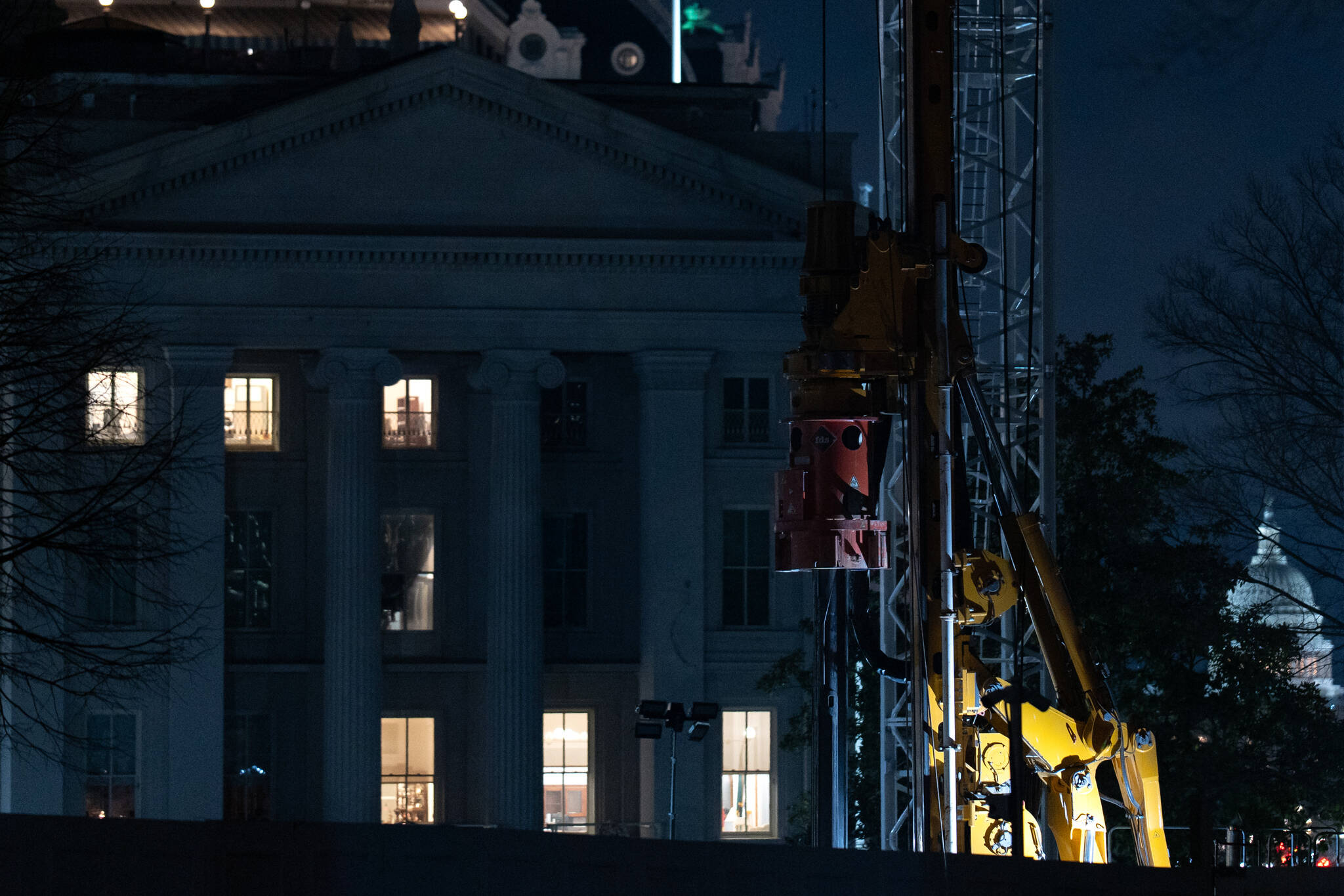 Construction equipment operating at night at the White House. (photo by Peter W. Stevenson/The Washington Post)