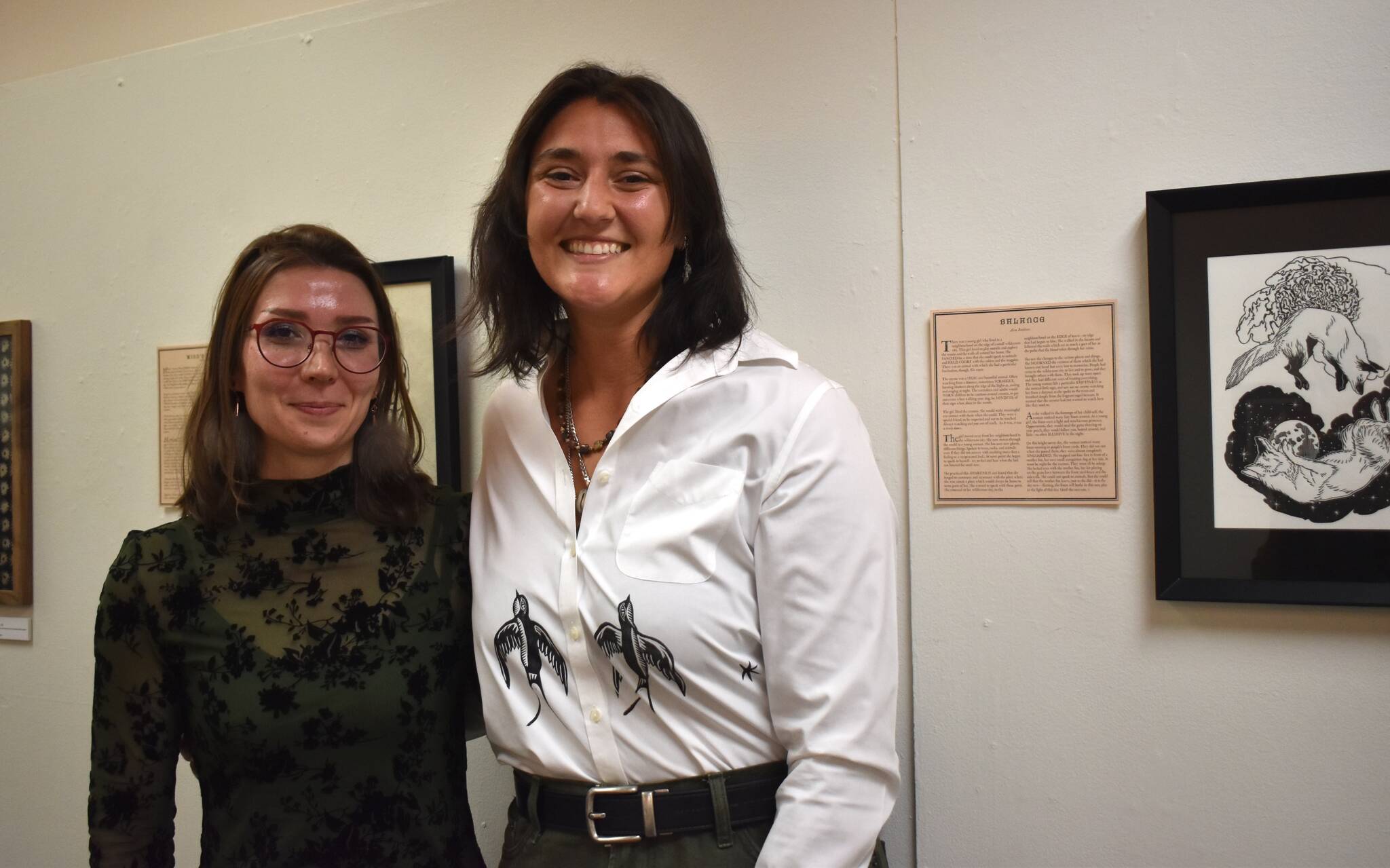 Alex Bookless and Rachel Levy stand before their exhibition, My Mothers Bones. (Mari Kanagy/Juneau Empire)