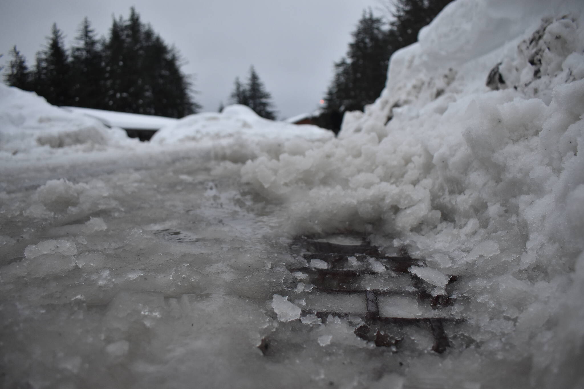 The City and Borough of Juneau encourages residents to assist in the efforts to clear storm drains as heavy rainfall is forecast (Mari Kanagy/Juneau Empire)
