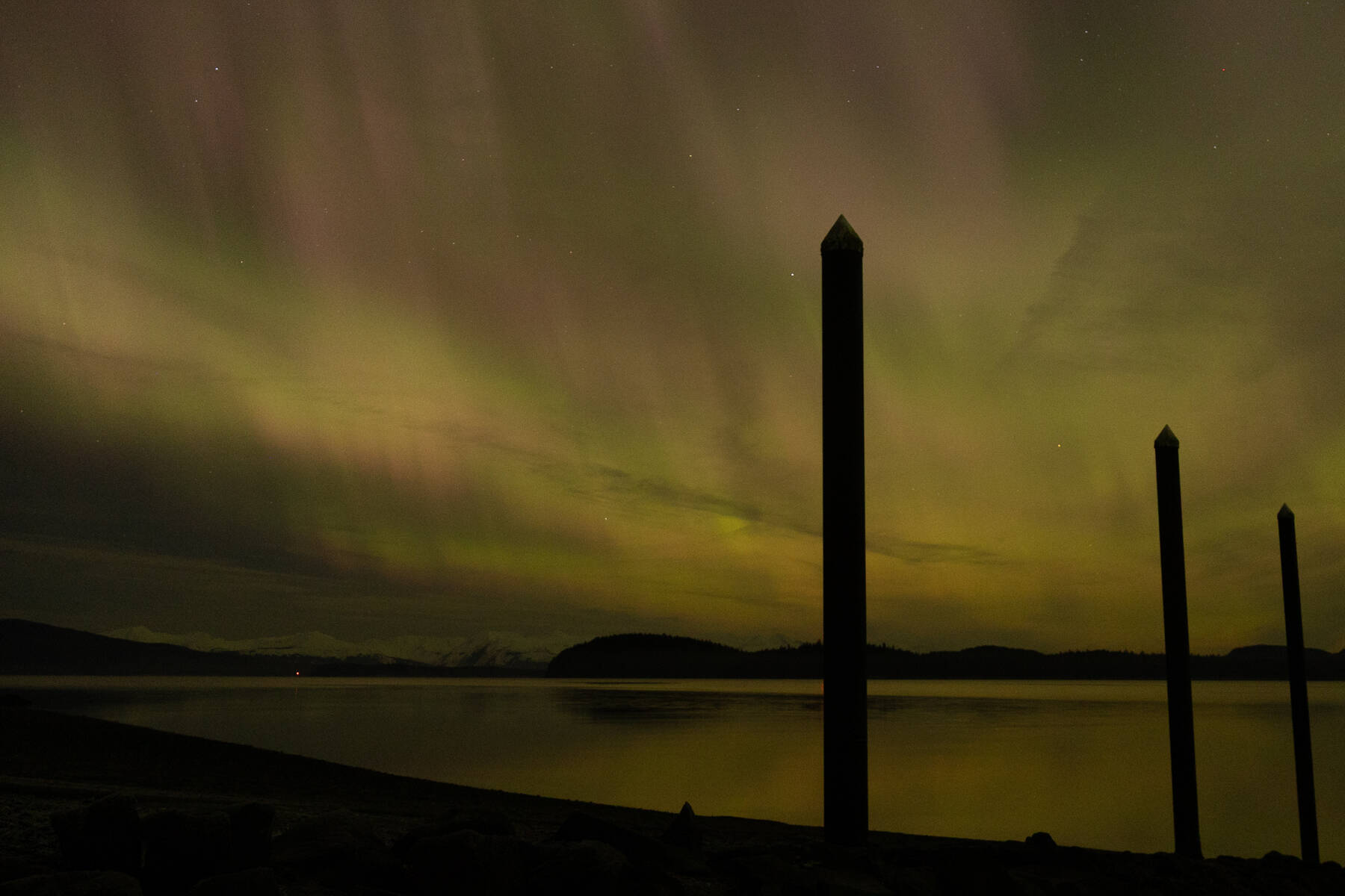 The northern lights are seen from the North Douglas launch ramp late Monday, Jan. 19. A magnetic storm caused unusually bright northern lights Monday evening and into Tuesday morning. (Chloe Anderson/Juneau Empire)