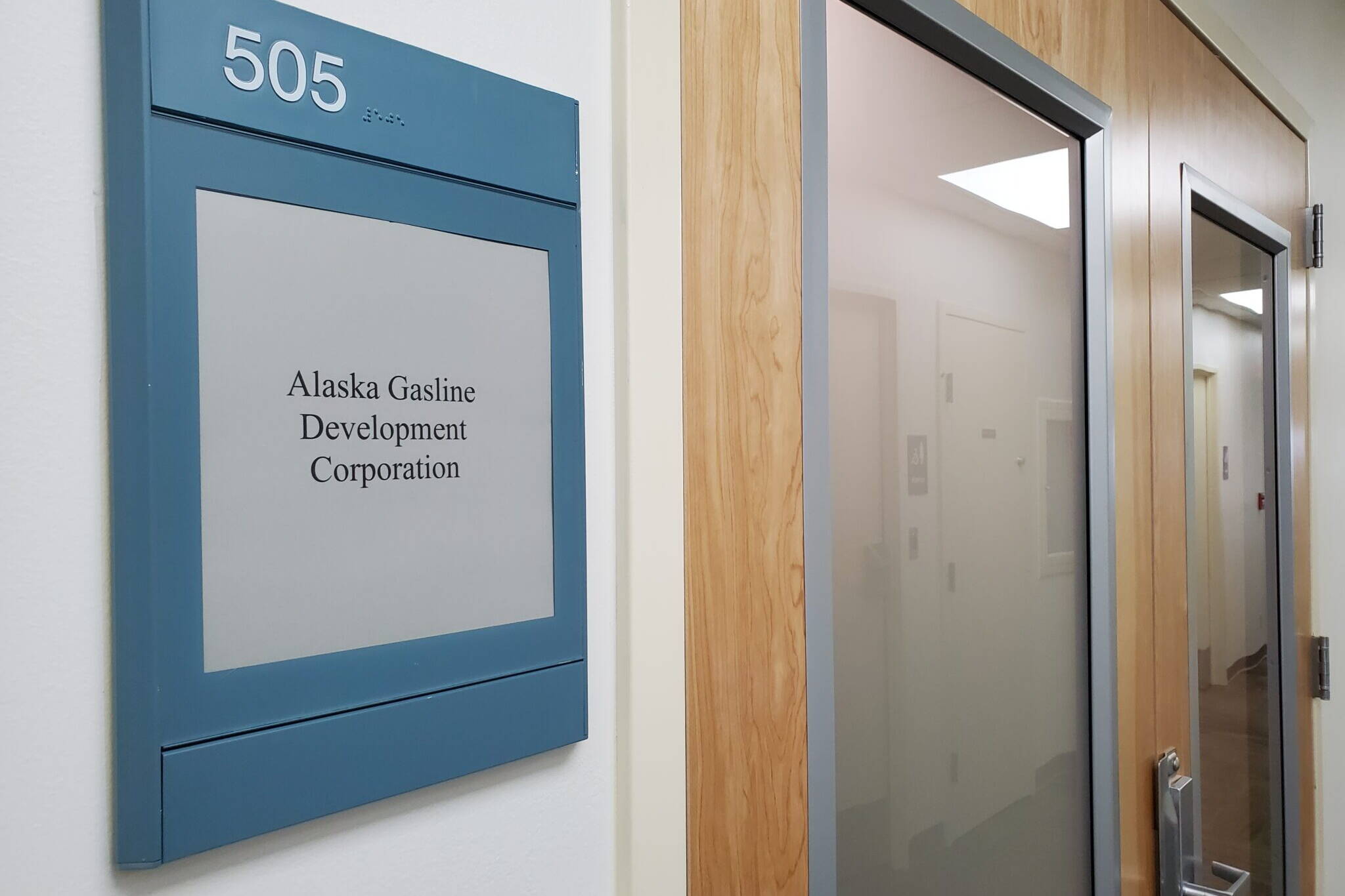 Yereth Rosen/Alaska Beacon
The entrance to the Alaska Gasline Development Corp.s Anchorage office is seen on Aug. 11, 2023. The state-owned AGDC is pushing for a massive project that would ship natural gas south from the North Slope, liquefy it and send it on tankers from Cook Inlet to Asian markets. The AGDC proposal is among many that have been raised since the 1970s to try commercialize the North Slopes stranded natural gas.