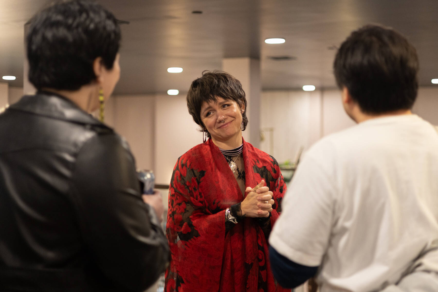 Tlingit artist Ursula Hudson speaks to attendees during the opening night of Gestures of Our Rebel Bodies, which features work from seven Indigenous artists, on Jan. 24, 2026. The exhibition will be on display at Aan Hít in downtown Juneau through May. (Chloe Anderson/Juneau Empire)