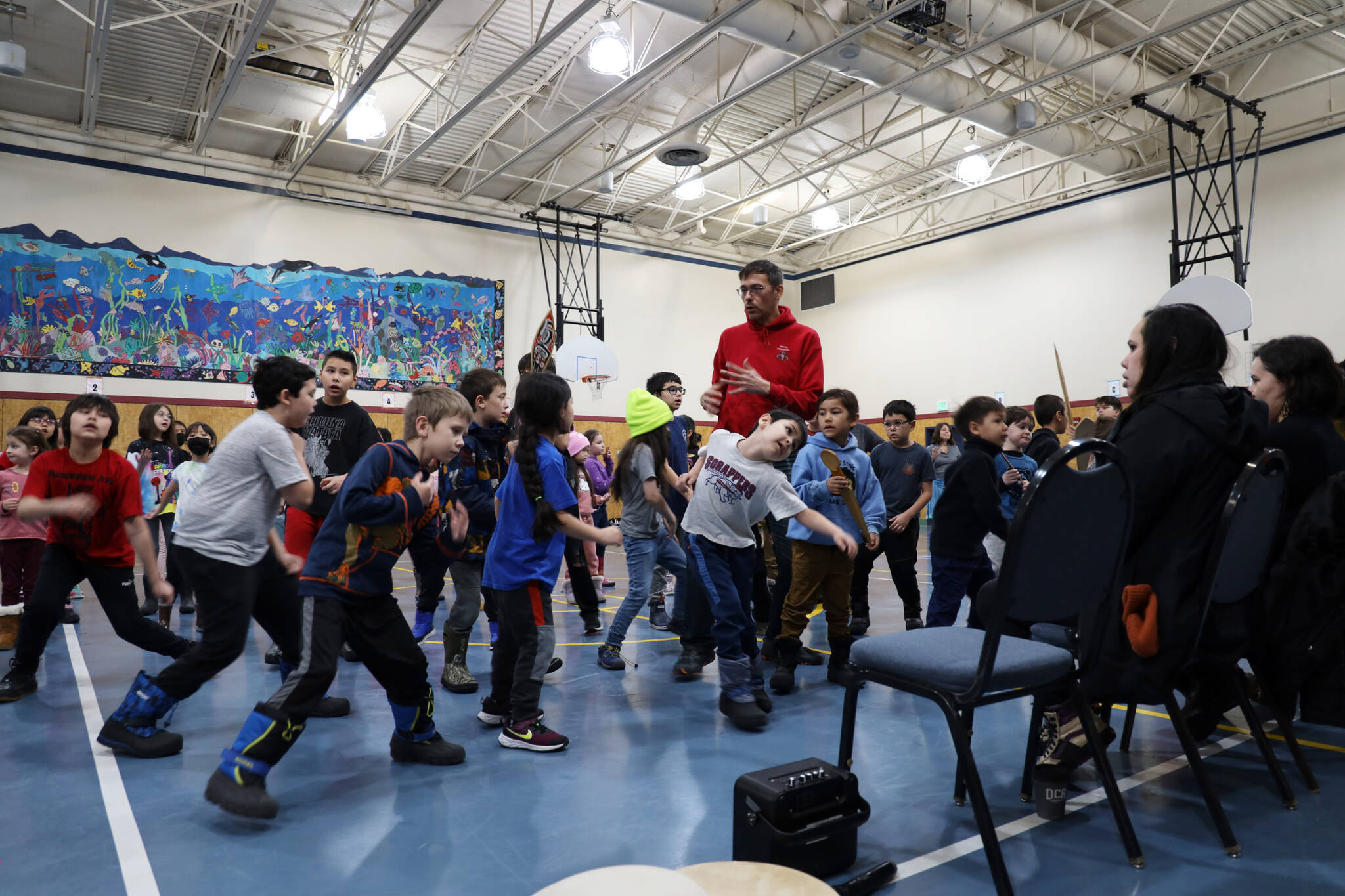 Students from the Tlingit Culture Language and Literacy program at Harborview Elementary School dance in front of elders during a program meeting in 2023. (Clarise Larson / Juneau Empire file photo)