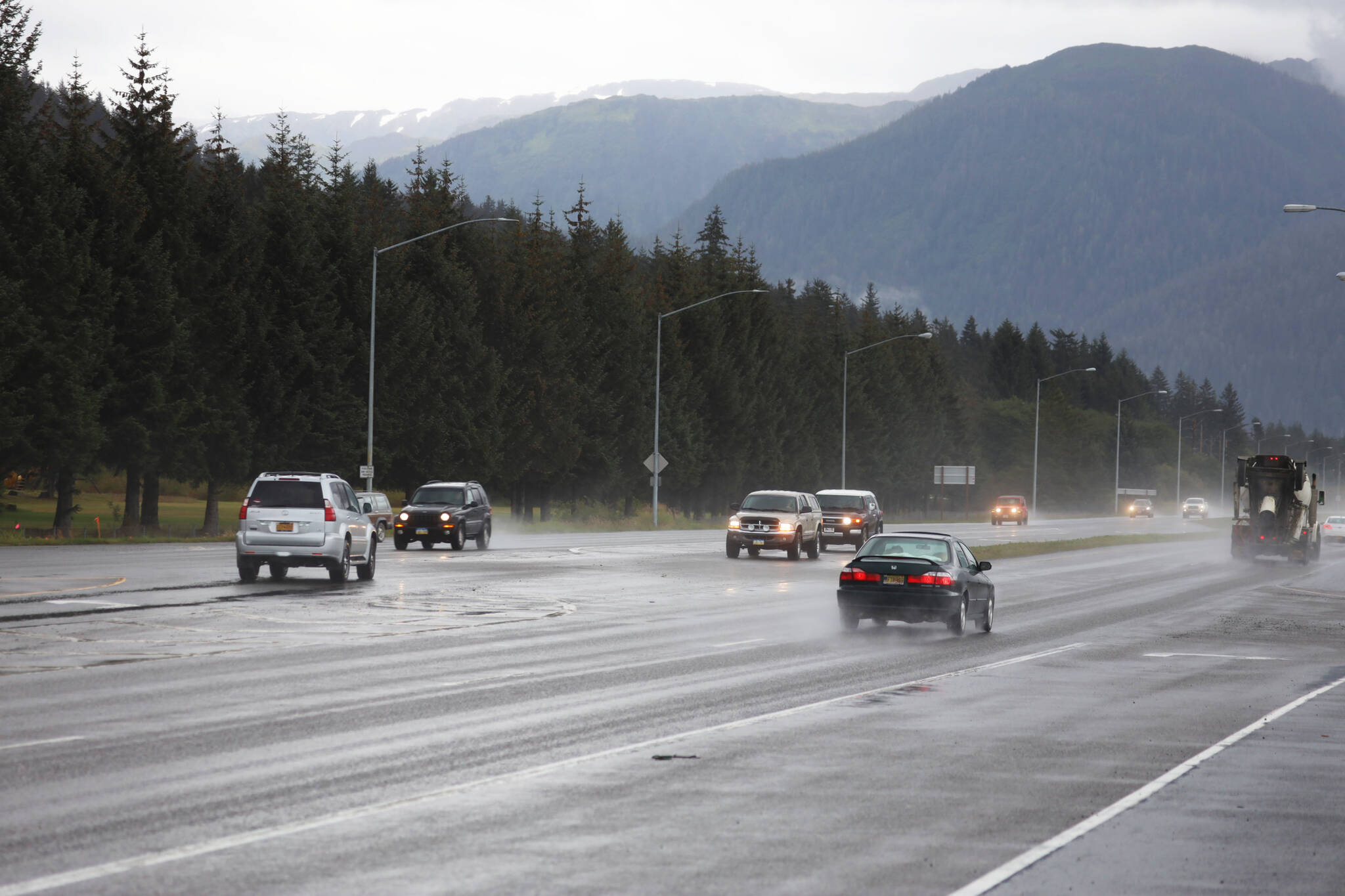 Cars pass down Egan Drive near the Fred Meyer intersection Thursday morning. (Clarise Larson / Juneau Empire file photo)