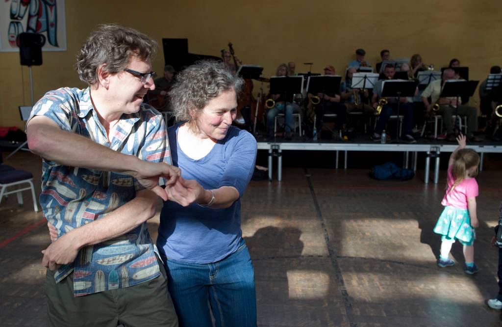 Dr. Alex Malter dances with Dr. Marna Schwartz to the music of the Thunder Mountain Big Band during the Block Party at the Juneau Arts & Culture Center on Friday, June 15, 2018. (Michael Penn | Juneau Empire)